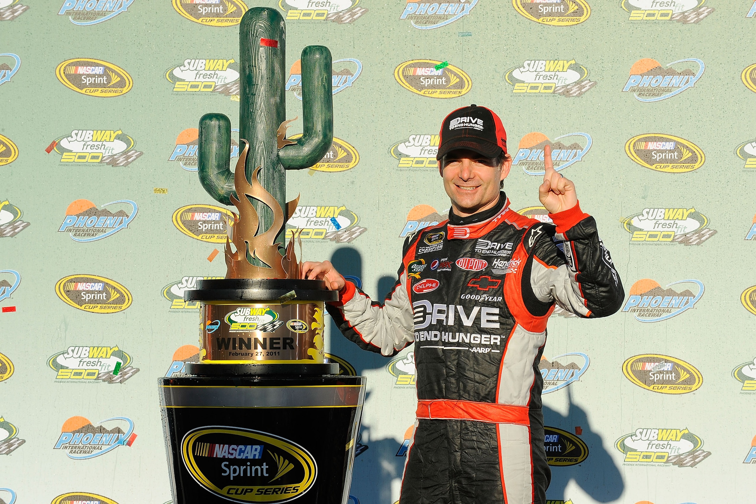 AVONDALE, AZ - FEBRUARY 27:  Jeff Gordon, driver of the #24 Drive to End Hunger Chevrolet, celebrates in victory lane after winning the NASCAR Sprint Cup Series Subway Fresh Fit 500 at Phoenix International Raceway on February 27, 2011 in Avondale, Arizon