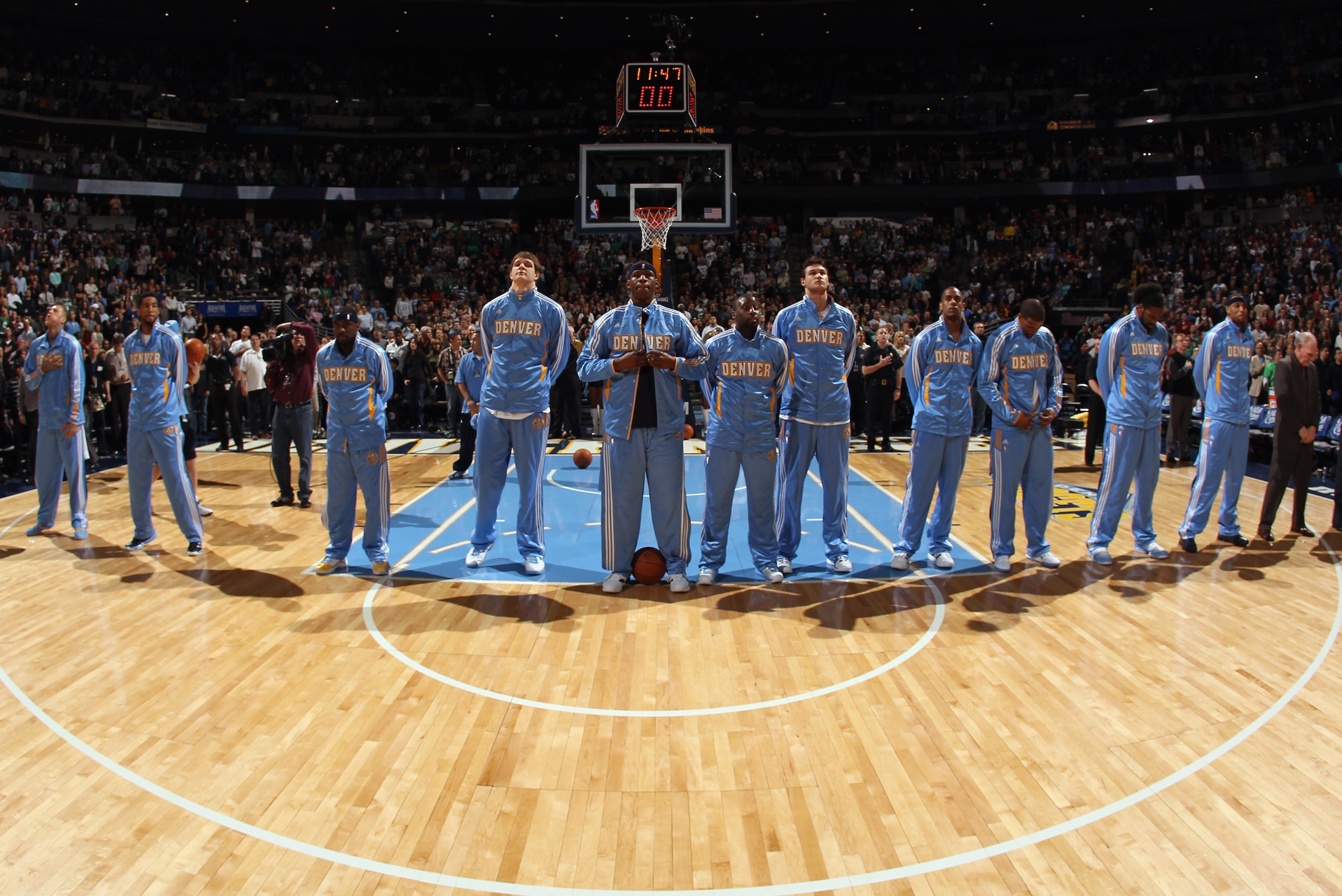 DENVER, CO - FEBRUARY 24: The Denver Nuggets observe the national anthem prior to facing the Boston Celtics during NBA action at the Pepsi Center on February 24, 2011 in Denver, Colorado. The Nuggets defeated the Celtics 89-75. NOTE TO USER: User express DENVER, CO - FEBRUARY 24: The Denver Nuggets observe the national anthem prior to facing the Boston Celtics during NBA action at the Pepsi Center on February 24, 2011 in Denver, Colorado. The Nuggets defeated the Celtics 89-75. NOTE TO USER: User express