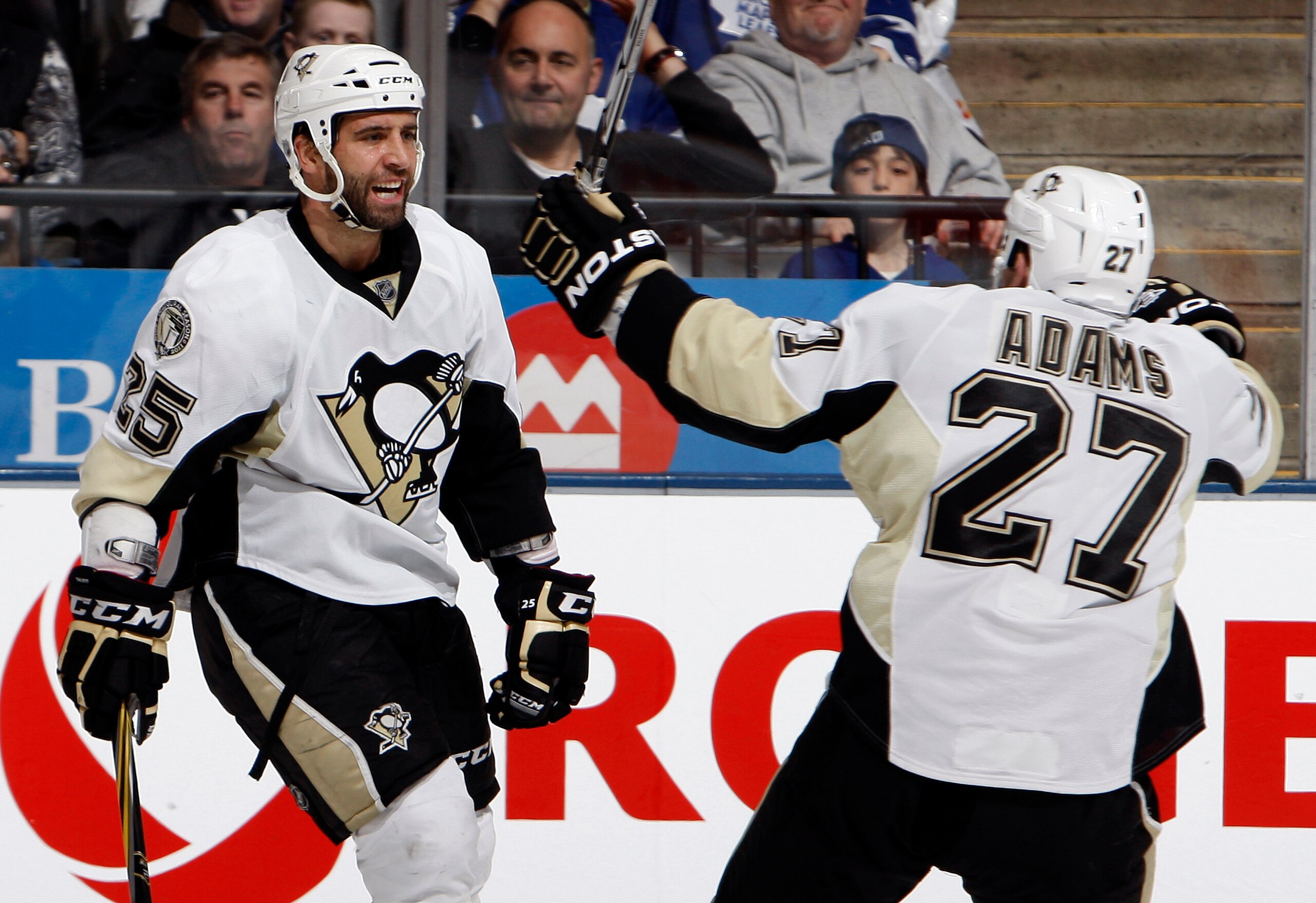 TORONTO, CANADA - FEBRUARY 26: Maxime Talbot #25 and Craig Adams #27 of the Pittsburgh Penguins celebrate Maxime Talbot goal during game action against the Toronto Maple Leafs at the Air Canada Centre February 26, 2011 in Toronto, Ontario, Canada. (Photo TORONTO, CANADA - FEBRUARY 26: Maxime Talbot #25 and Craig Adams #27 of the Pittsburgh Penguins celebrate Maxime Talbot goal during game action against the Toronto Maple Leafs at the Air Canada Centre February 26, 2011 in Toronto, Ontario, Canada. (Photo