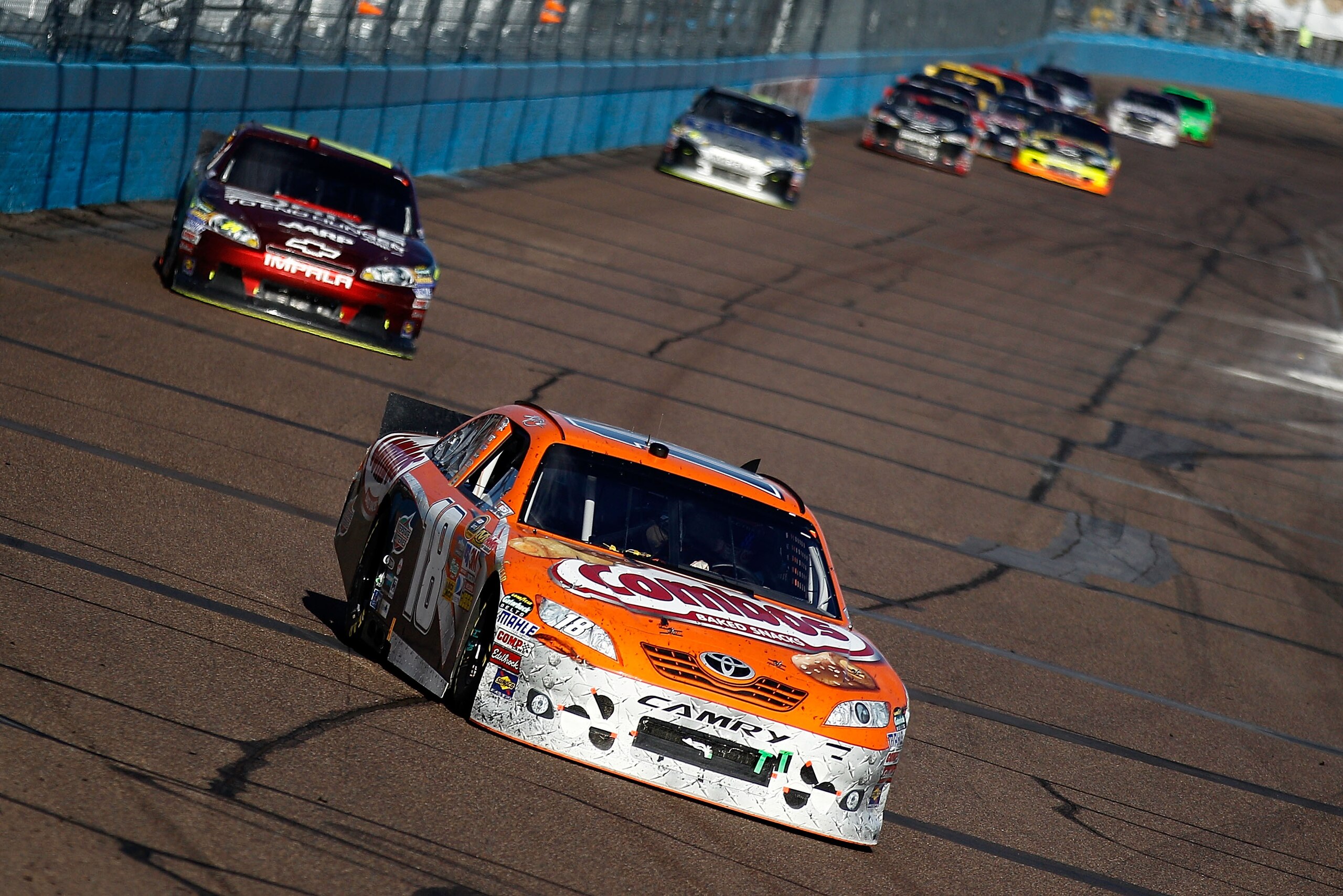 AVONDALE, AZ - FEBRUARY 27:  Kyle Busch, driver of the #18 Combos Toyota leads Jeff Gordon, driver of the #24  Drive to End Hunger Chevrolet near the end of the Subway Fresh Fit 500 at Phoenix International Raceway on February 27, 2011 in Avondale, Arizon