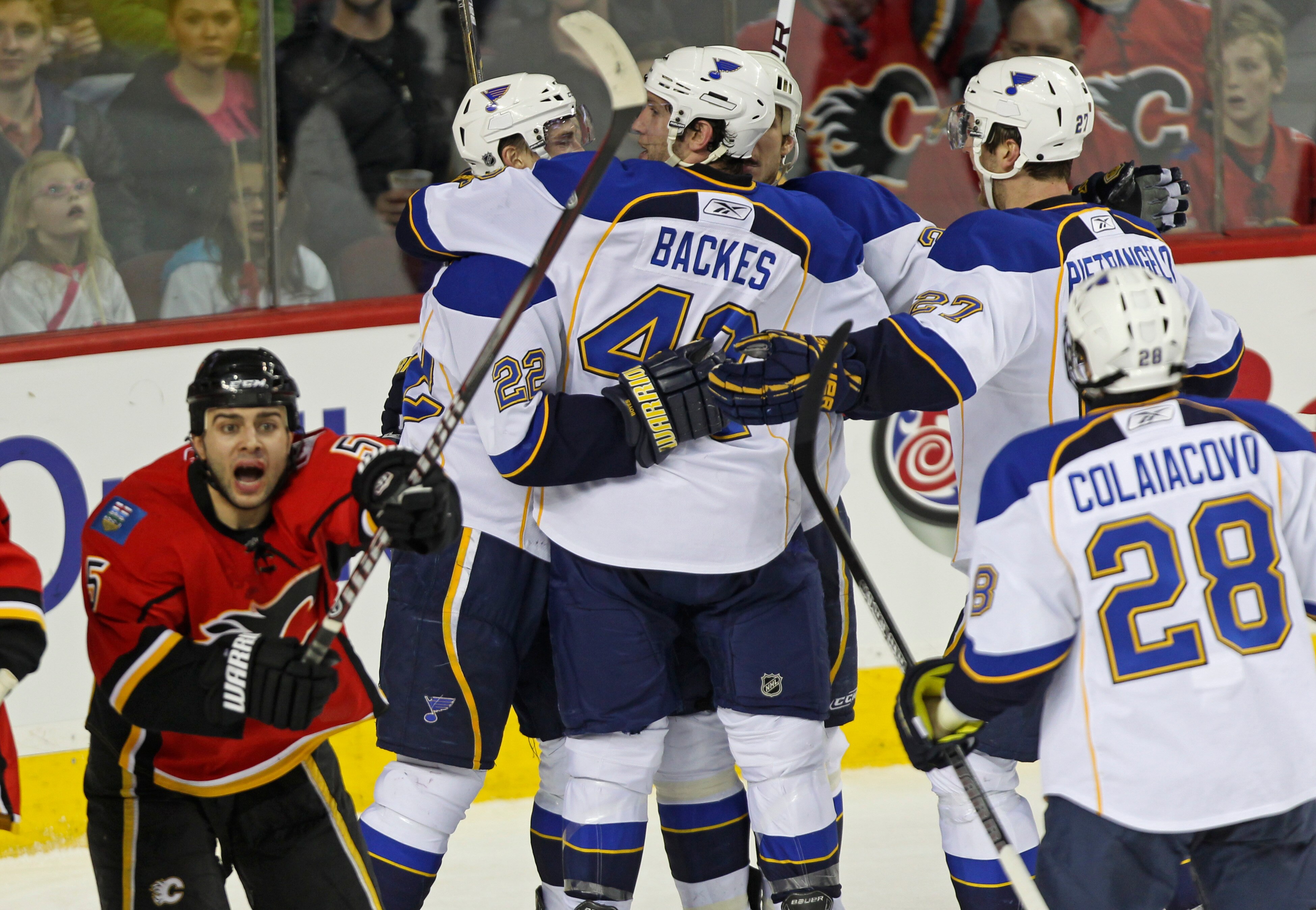 CALGARY, AB - FEBRUARY 27:  The St. Louis Blues celebrate their potential tying goal in the third period of NHL action while Calgary Flames Mark Giiordan #5 indicates the puck was put in by a high stick on February 27, 2011 at the Scotiabank Saddledome in