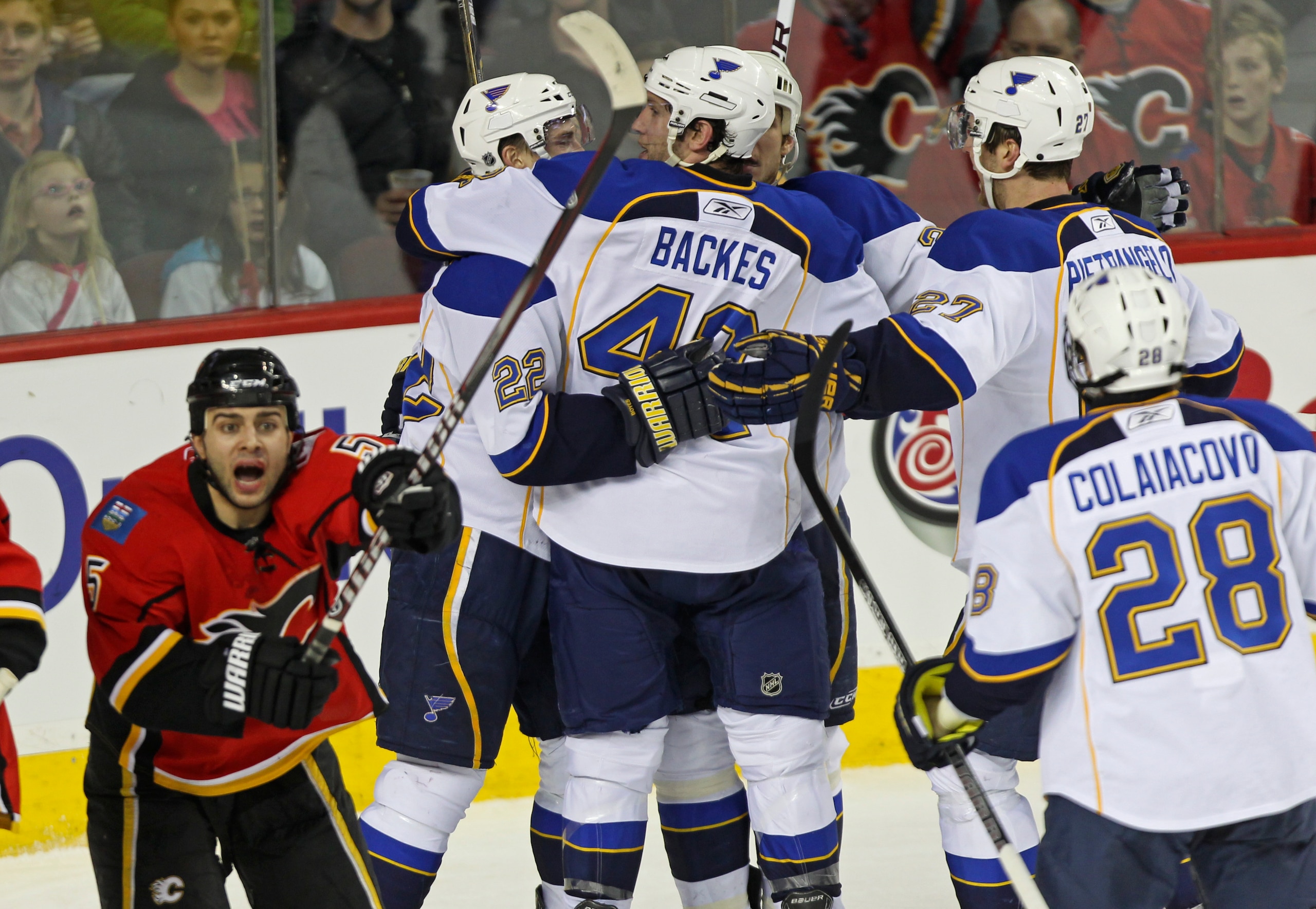 CALGARY, AB - FEBRUARY 27: The St. Louis Blues celebrate their potential tying goal in the third period of NHL action while Calgary Flames Mark Giiordan #5 indicates the puck was put in by a high stick on February 27, 2011 at the Scotiabank Saddledome in CALGARY, AB - FEBRUARY 27: The St. Louis Blues celebrate their potential tying goal in the third period of NHL action while Calgary Flames Mark Giiordan #5 indicates the puck was put in by a high stick on February 27, 2011 at the Scotiabank Saddledome in
