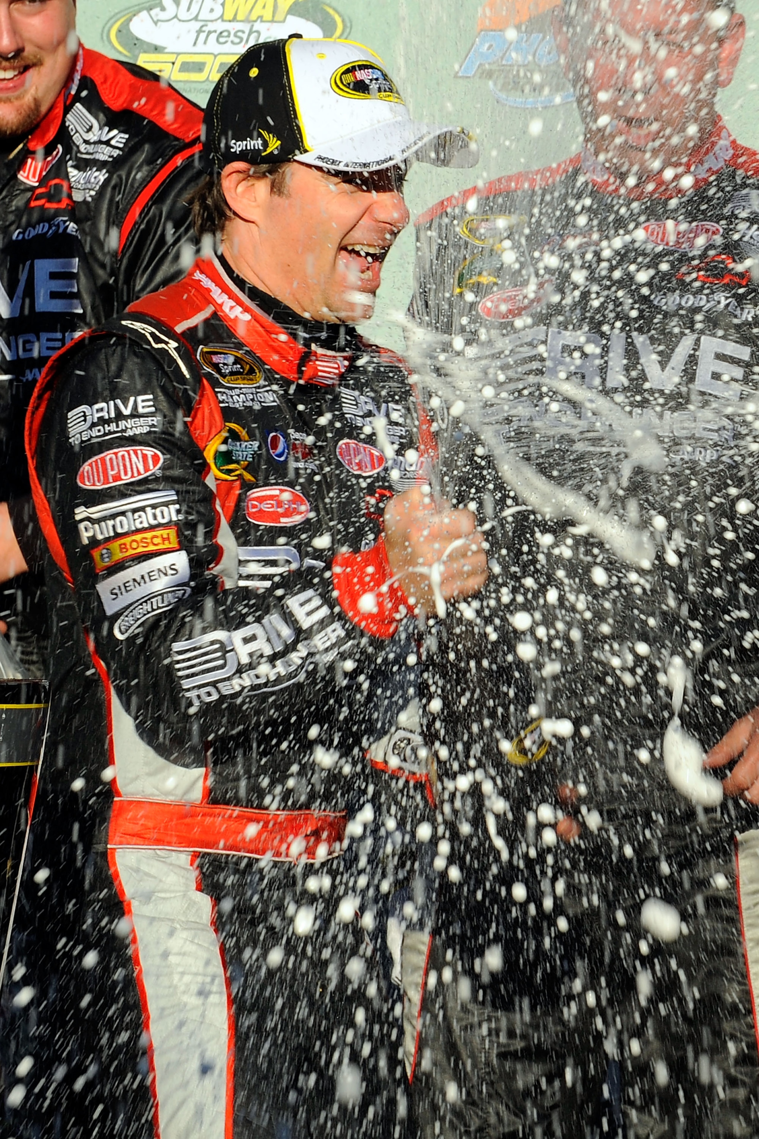 AVONDALE, AZ - FEBRUARY 27:  Jeff Gordon, driver of the #24 Drive to End Hunger Chevrolet, celebrates in victory lane after winning the NASCAR Sprint Cup Series Subway Fresh Fit 500 at Phoenix International Raceway on February 27, 2011 in Avondale, Arizon