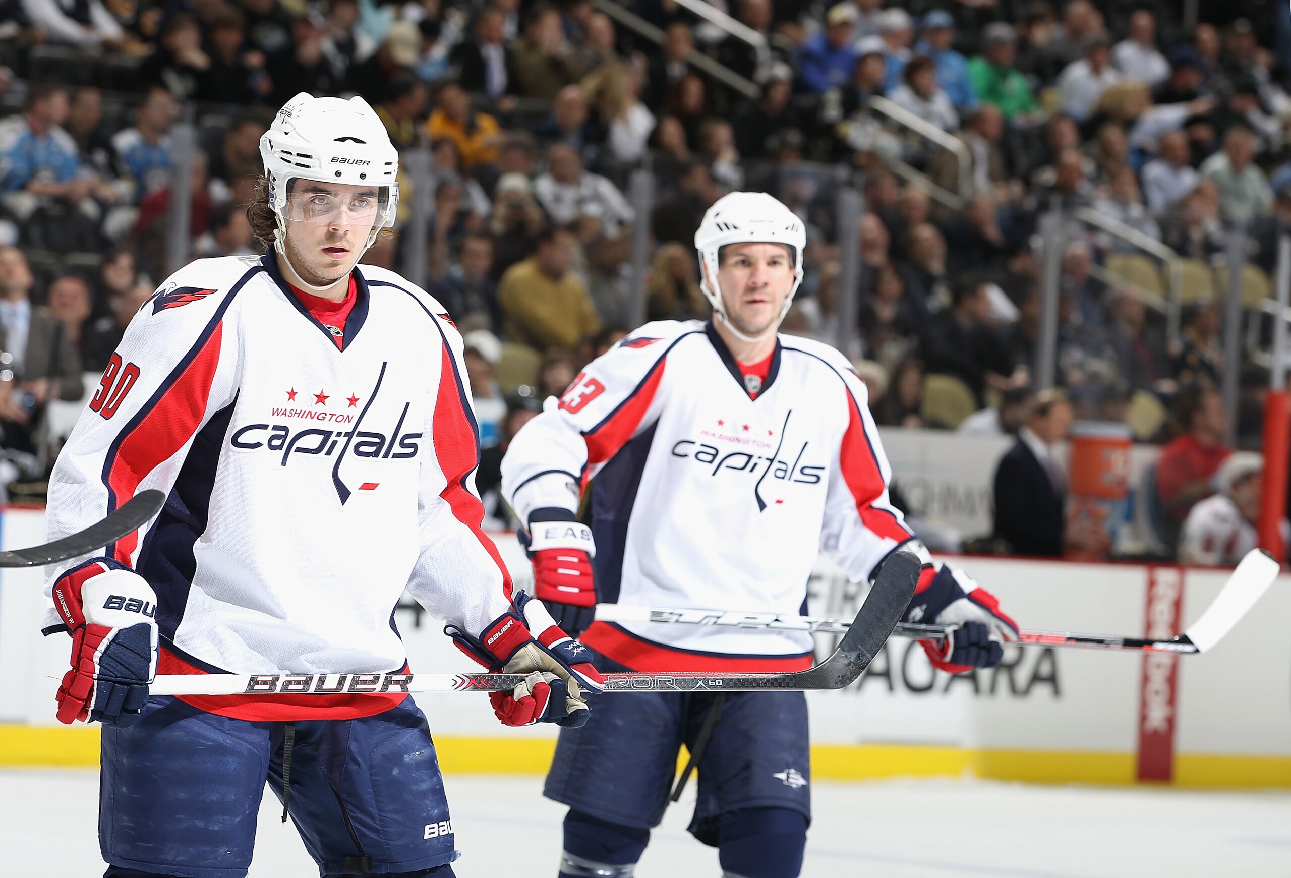 PITTSBURGH, PA - FEBRUARY 21: Marcus Johansson #90 and Scott Hannan #23 of the Washington Capitals during the NHL game against the Pittsburgh Penguins at Consol Energy Center on February 21, 2011 in Pittsburgh, Pennsylvania. The Capitals defeated the Pen PITTSBURGH, PA - FEBRUARY 21: Marcus Johansson #90 and Scott Hannan #23 of the Washington Capitals during the NHL game against the Pittsburgh Penguins at Consol Energy Center on February 21, 2011 in Pittsburgh, Pennsylvania. The Capitals defeated the Pen