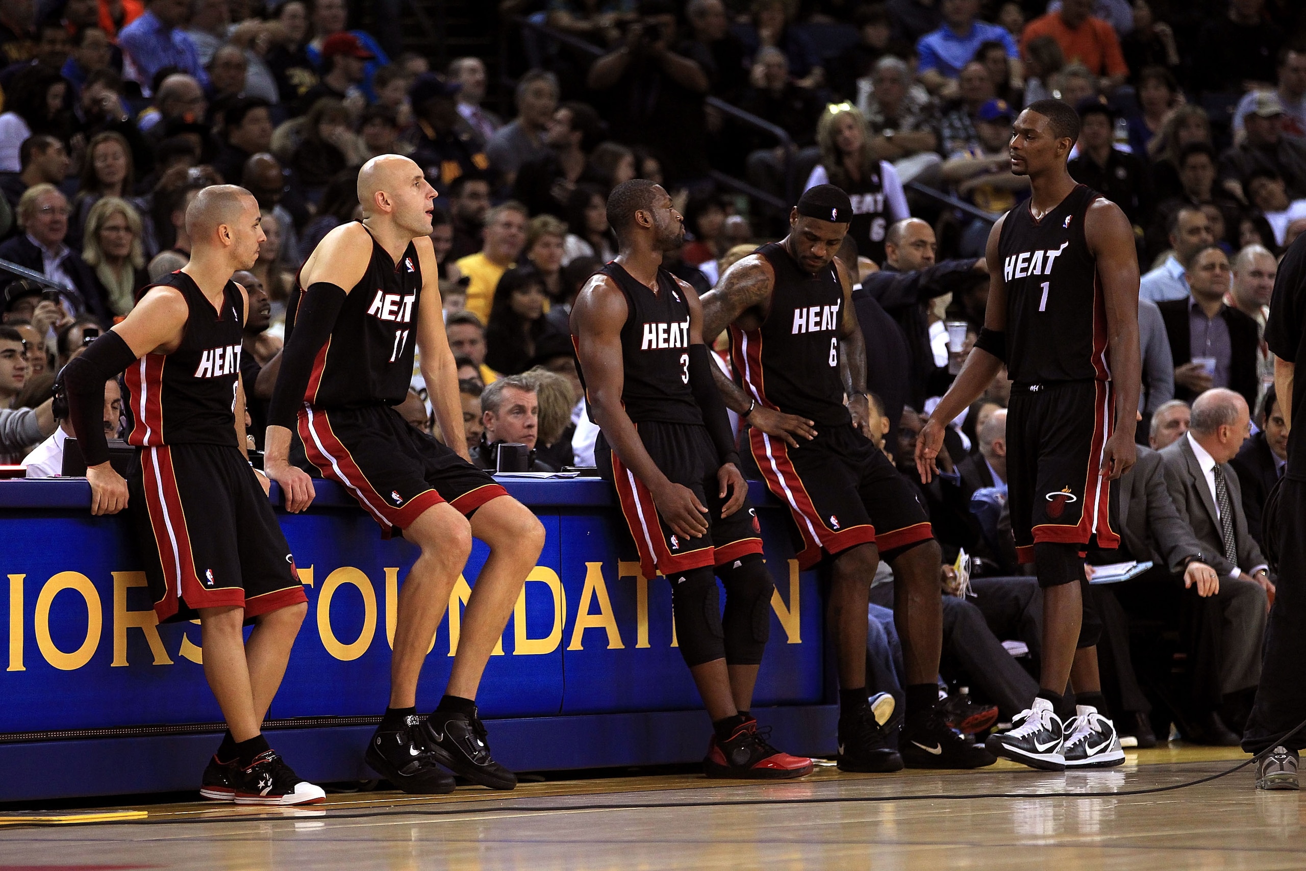 OAKLAND, CA - DECEMBER 10: Carlos Arroyo #8, Zydrunas Ilgauskas #11, Dwyane Wade #3, LeBron James #6 and Chris Bosh #1 of the Miami Heat wait on the side of the court during a time out of their game against the Golden State Warriors at Oracle Arena on Dec OAKLAND, CA - DECEMBER 10: Carlos Arroyo #8, Zydrunas Ilgauskas #11, Dwyane Wade #3, LeBron James #6 and Chris Bosh #1 of the Miami Heat wait on the side of the court during a time out of their game against the Golden State Warriors at Oracle Arena on Dec