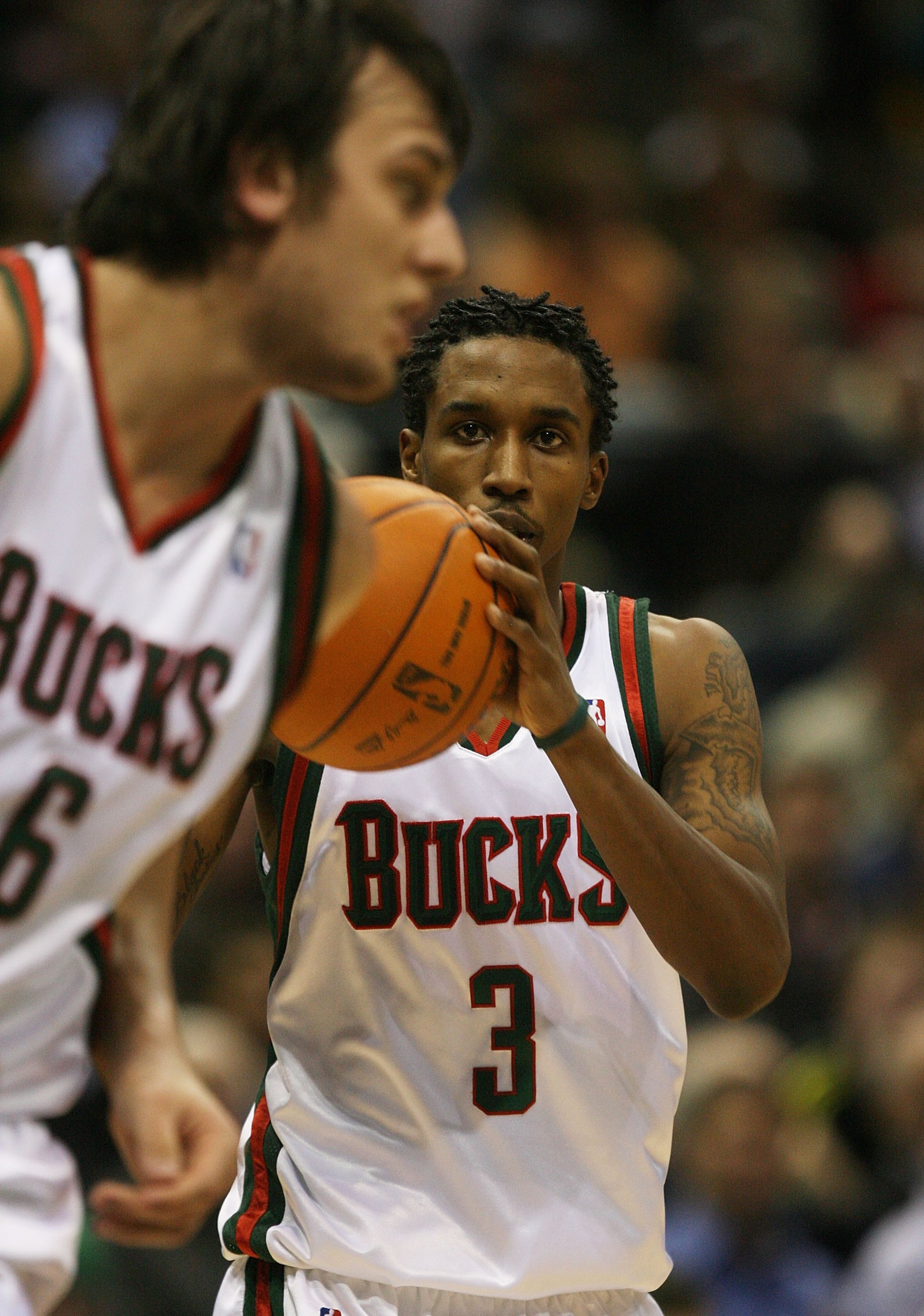 MILWAUKEE - NOVEMBER 16: Brandon Jennings #3 of the Milwuakee Bucks looks to pass to teammate Andrew Bogut #6 against the Dallas Mavericks at the Bradley Center on November 16, 2009 in Milwaukee, Wisconsin. The Mavericks defeated the Bucks 115-113 in over MILWAUKEE - NOVEMBER 16: Brandon Jennings #3 of the Milwuakee Bucks looks to pass to teammate Andrew Bogut #6 against the Dallas Mavericks at the Bradley Center on November 16, 2009 in Milwaukee, Wisconsin. The Mavericks defeated the Bucks 115-113 in over