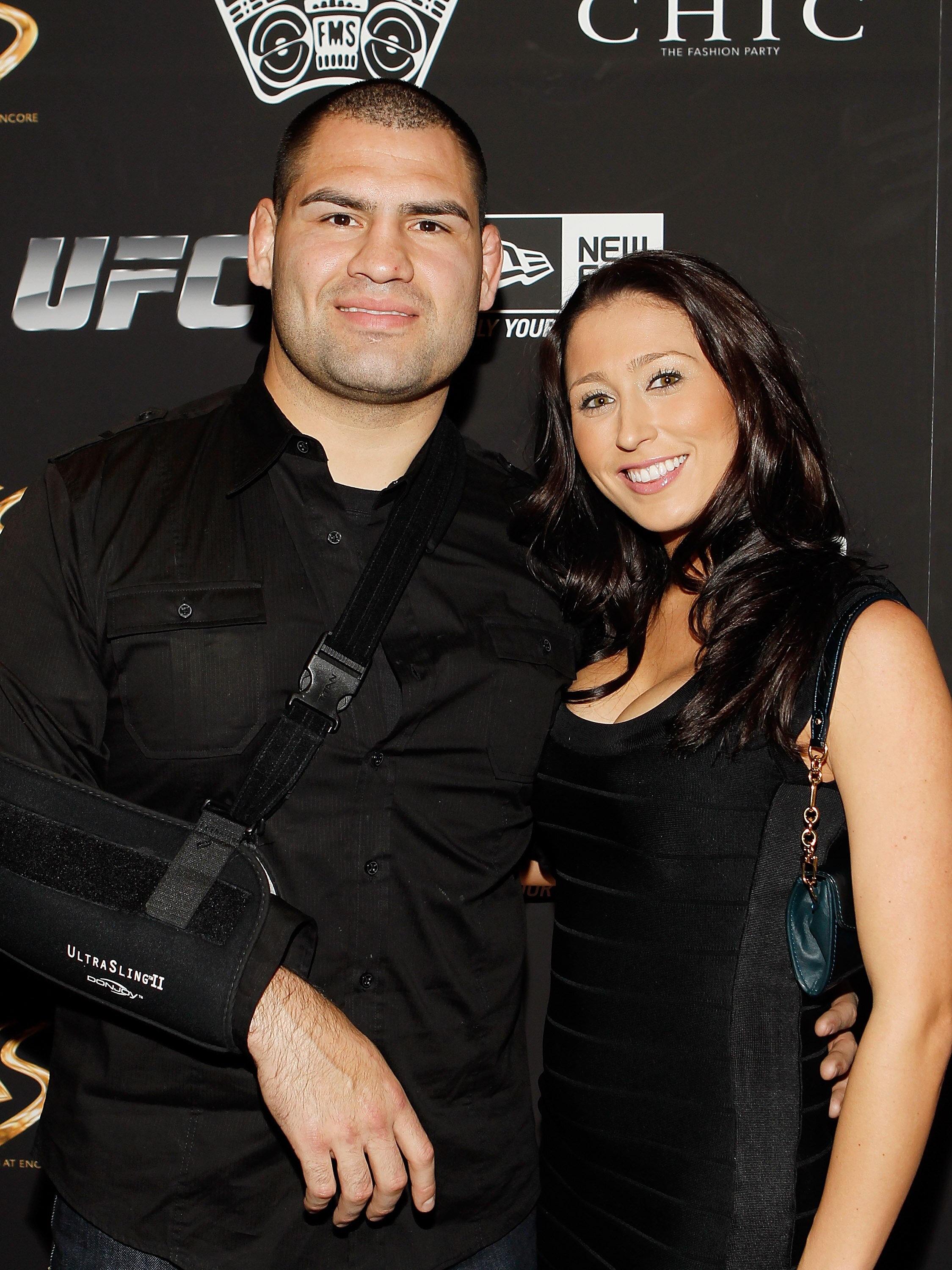 LAS VEGAS - FEBRUARY 15:  UFC fighter Cain Velasquez, left, and his fiance' Michelle Borquez arrive at UFC, Famous Stars and Straps and New Era's 'The Magic Party' at XS the nightclub on February 15, 2011 in Las Vegas, Nevada.  (Photo by Isaac Brekken/Get