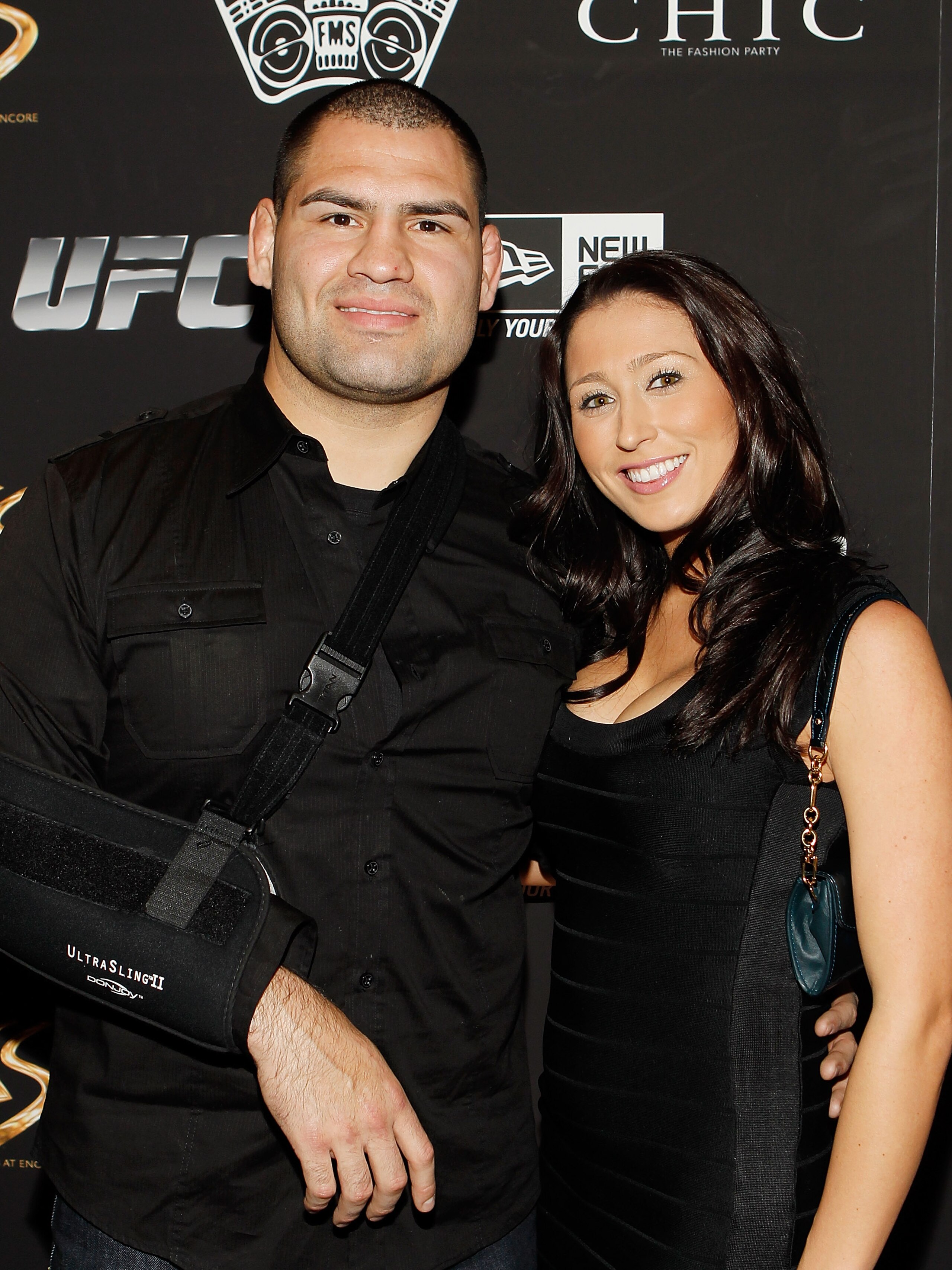 LAS VEGAS - FEBRUARY 15:  UFC fighter Cain Velasquez, left, and his fiance' Michelle Borquez arrive at UFC, Famous Stars and Straps and New Era's 'The Magic Party' at XS the nightclub on February 15, 2011 in Las Vegas, Nevada.  (Photo by Isaac Brekken/Get