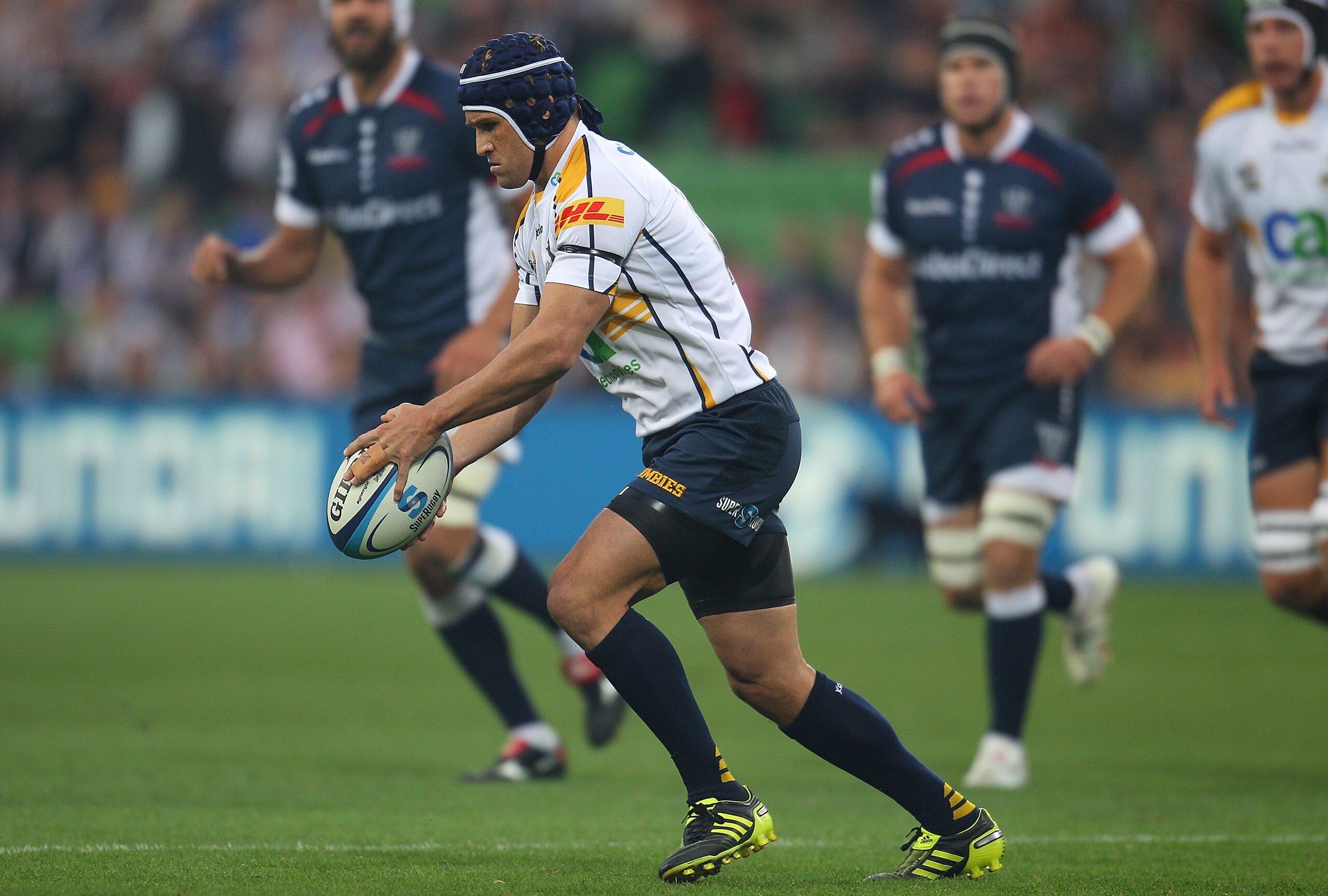 MELBOURNE, AUSTRALIA - FEBRUARY 25:  Matt Giteau of the Brumbies looks to kick the ball during the round two Super Rugby match between the Melbourne Rebels and the Brumbies at AAMI Park on February 25, 2011 in Melbourne, Australia.  (Photo by Scott Barbou
