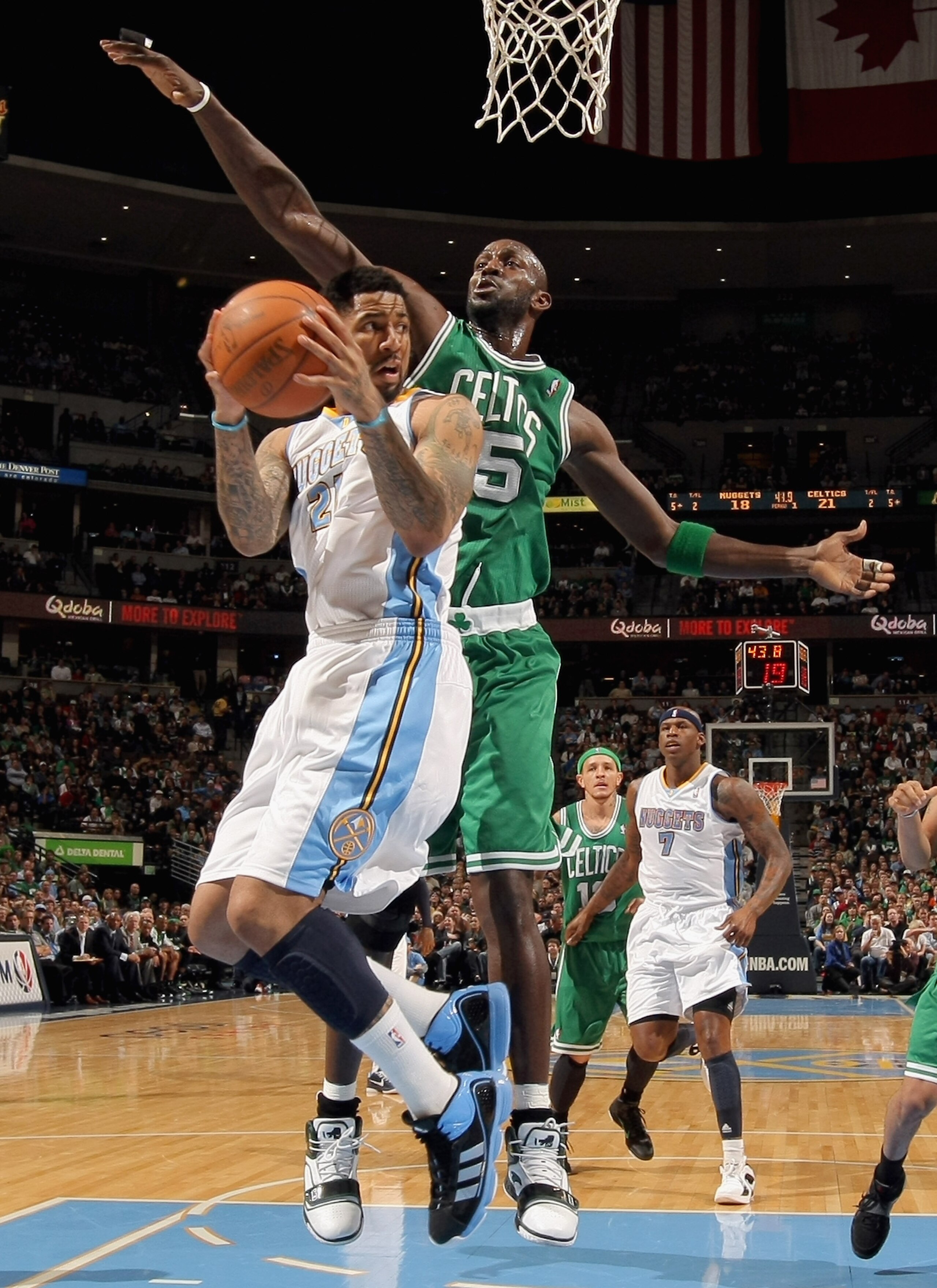 DENVER, CO - FEBRUARY 24:  Wilson Chandler #21 of the Denver Nuggets tries to get off a shot against the defense of  Kevin Garnett #5 of the Boston Celtics during NBA action at the Pepsi Center on February 24, 2011 in Denver, Colorado. NOTE TO USER: User