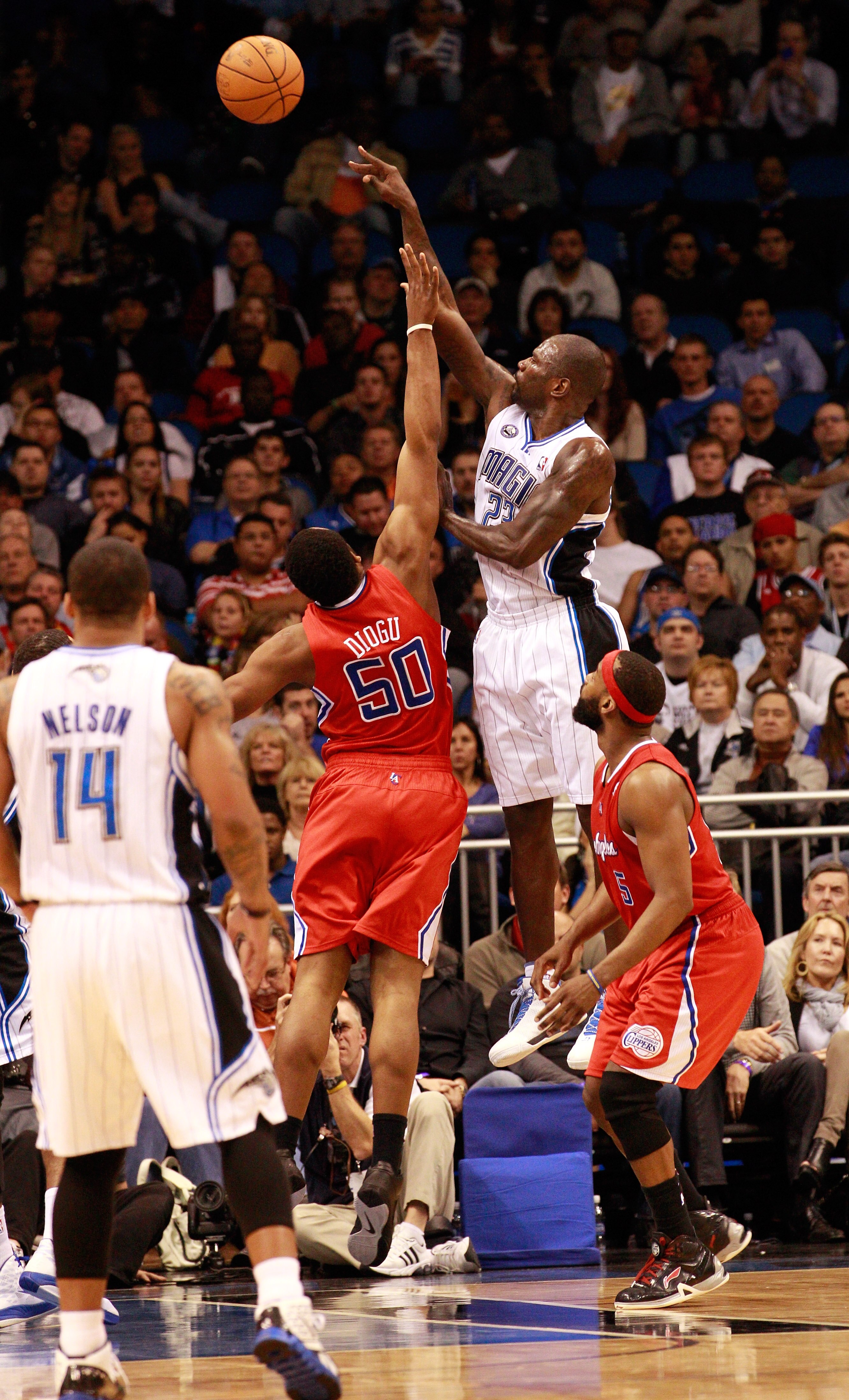 ORLANDO, FL - FEBRUARY 08:  Jason Richardson #23 of the Orlando Magic attempts a shot against Ike Diogu #50 of the Los Angeles Clippers during the game at Amway Arena on February 8, 2011 in Orlando, Florida.  NOTE TO USER: User expressly acknowledges and
