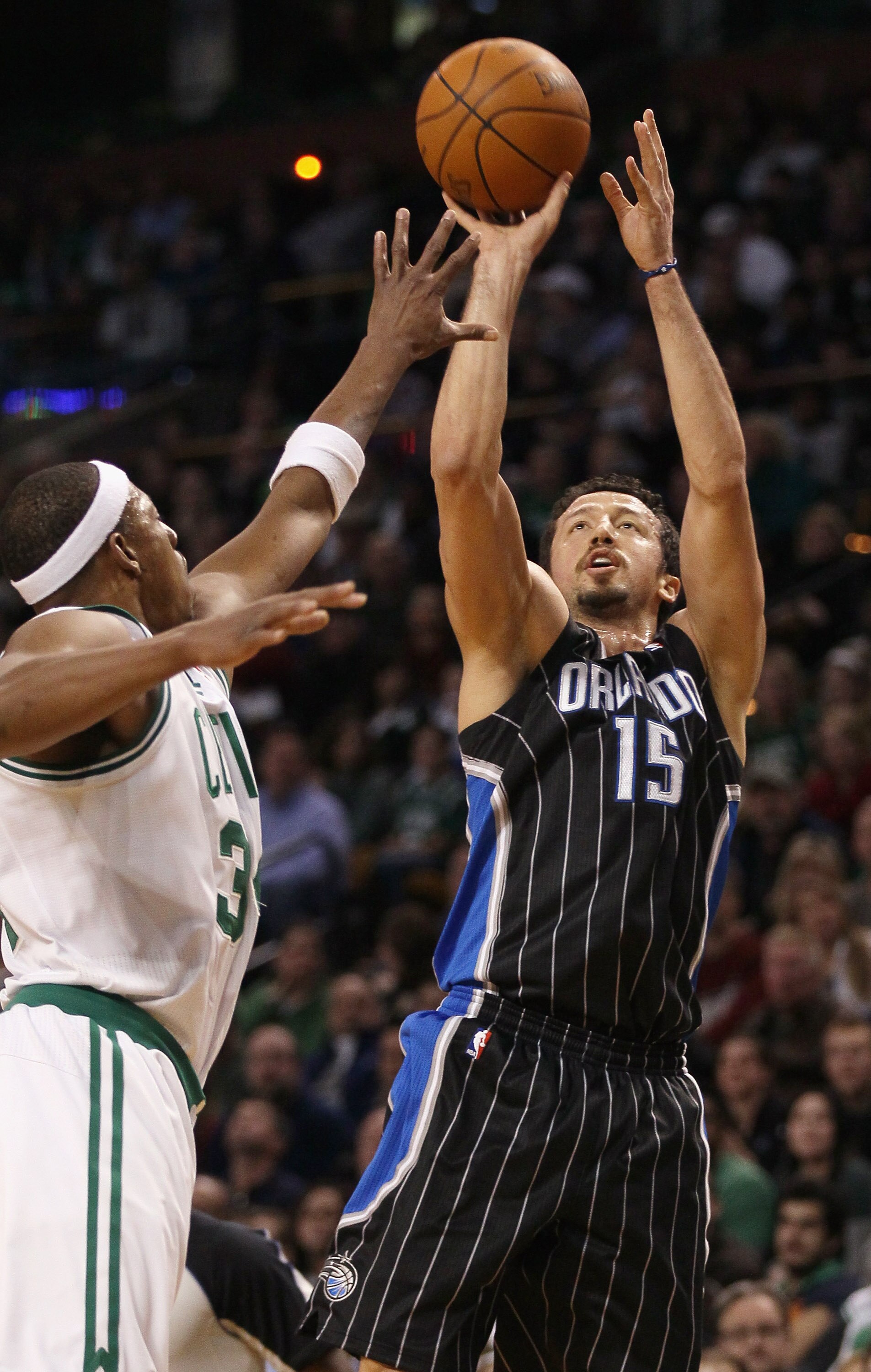 BOSTON, MA - JANUARY 17:   Hedo Turkoglu #15 of the Orlando Magic takes a shot as Paul Pierce #34 of the Boston Celtics defends on January 17, 2011 at the TD Garden in Boston, Massachusetts. The Celtics defeated the Magic 109-106.  NOTE TO USER: User expr