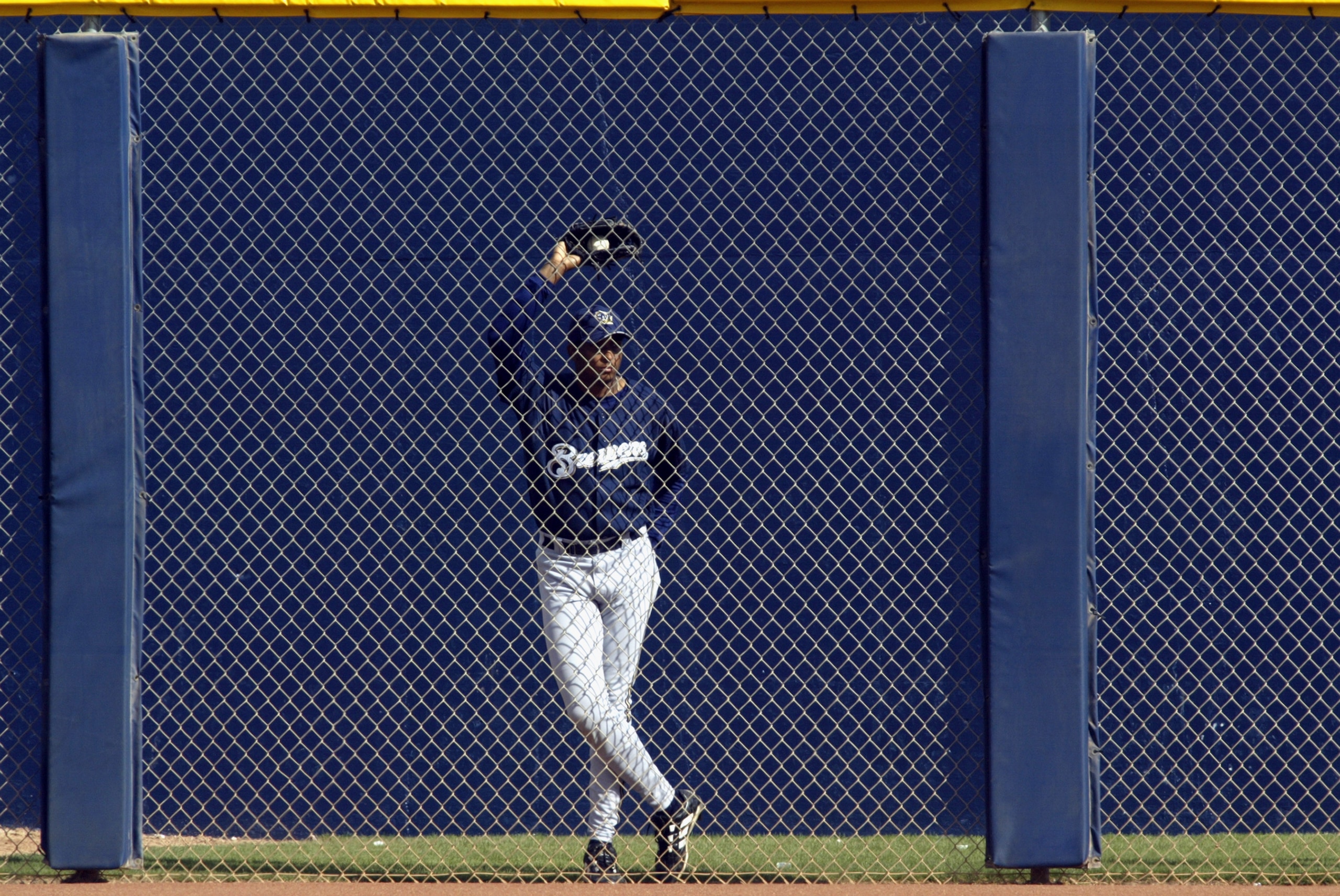 PEORIA, AZ - MARCH 4:  Luis Martinez #59 of the Milwaukee Brewers watches his team play the Seattle Mariners from the bullpen in a spring training game on March 4, 2003 at Peoria Sports Complex in Peoria, Arizona.   The Mariners defeated the Brewers 6-3.