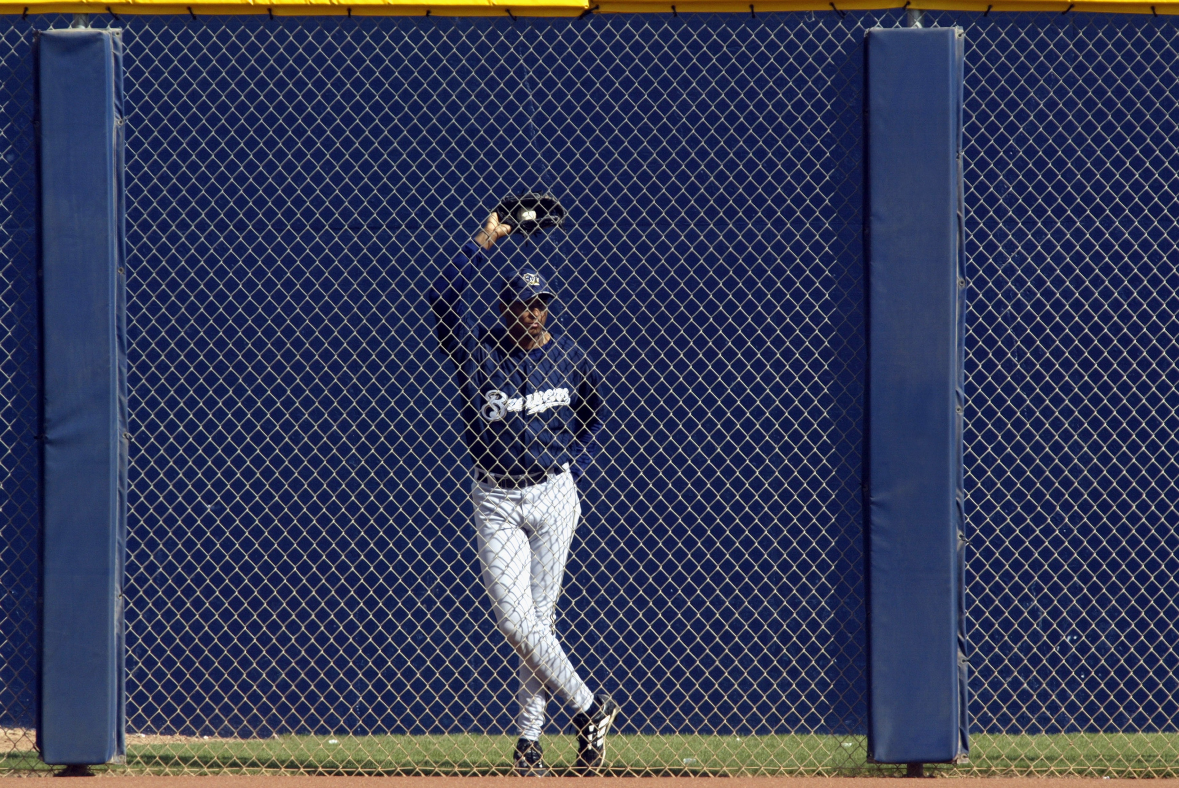 PEORIA, AZ - MARCH 4: Luis Martinez #59 of the Milwaukee Brewers watches his team play the Seattle Mariners from the bullpen in a spring training game on March 4, 2003 at Peoria Sports Complex in Peoria, Arizona. The Mariners defeated the Brewers 6-3. PEORIA, AZ - MARCH 4: Luis Martinez #59 of the Milwaukee Brewers watches his team play the Seattle Mariners from the bullpen in a spring training game on March 4, 2003 at Peoria Sports Complex in Peoria, Arizona. The Mariners defeated the Brewers 6-3.