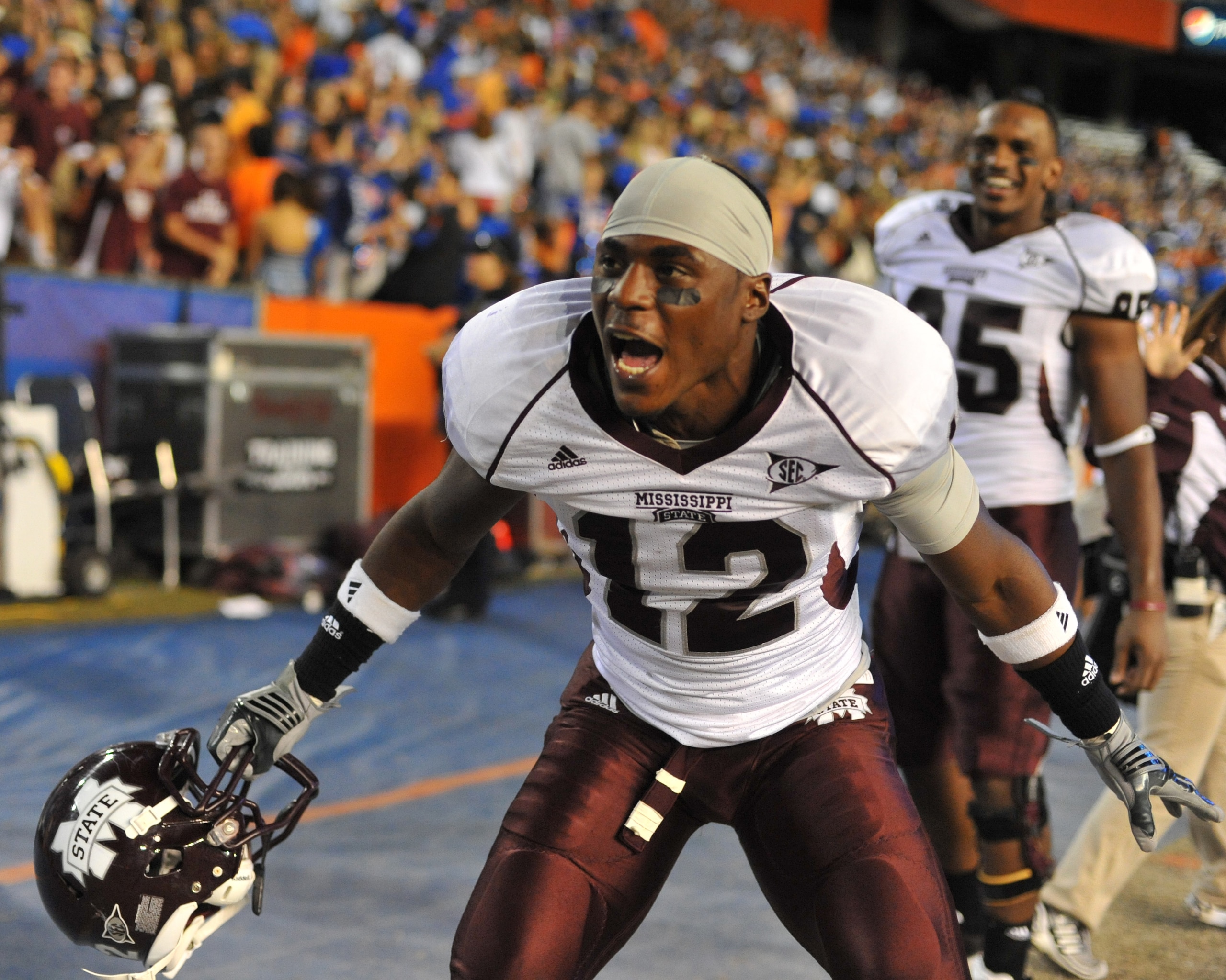 GAINESVILLE, FL - OCTOBER 16:  Defensive back Dennis Thames #12 of the Mississippi State Bulldogs celebrates a 10 - 7 victory against the Florida Gators October 16, 2010 Ben Hill Griffin Stadium at Gainesville, Florida.  (Photo by Al Messerschmidt/Getty I