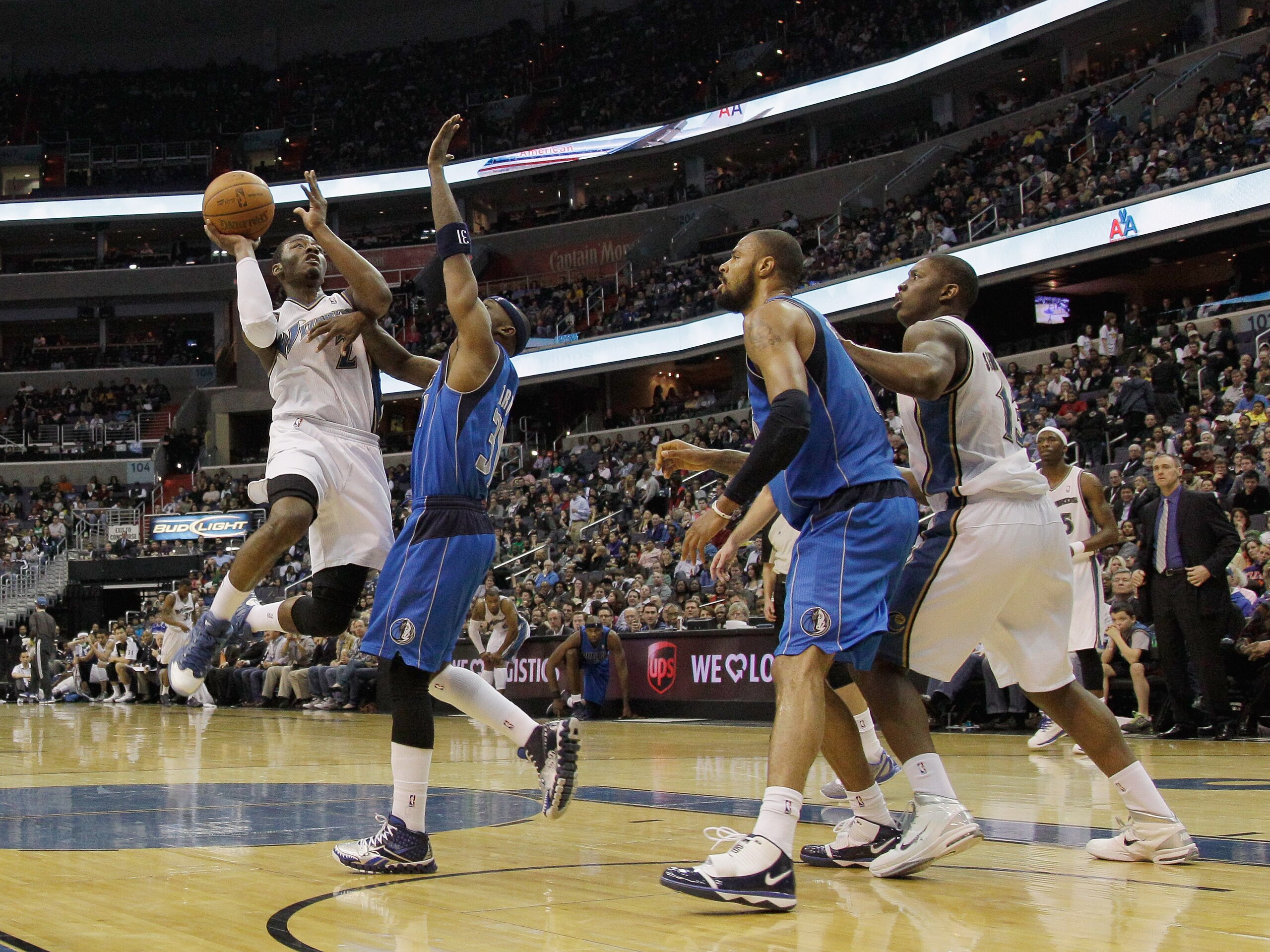 WASHINGTON, DC - FEBRUARY 26:  John Wall #2 of the Washington Wizards shoots over the defense of the Dallas Mavericks at the Verizon Center on February 26, 2011 in Washington, DC. NOTE TO USER: User expressly acknowledges and agrees that, by downloading a