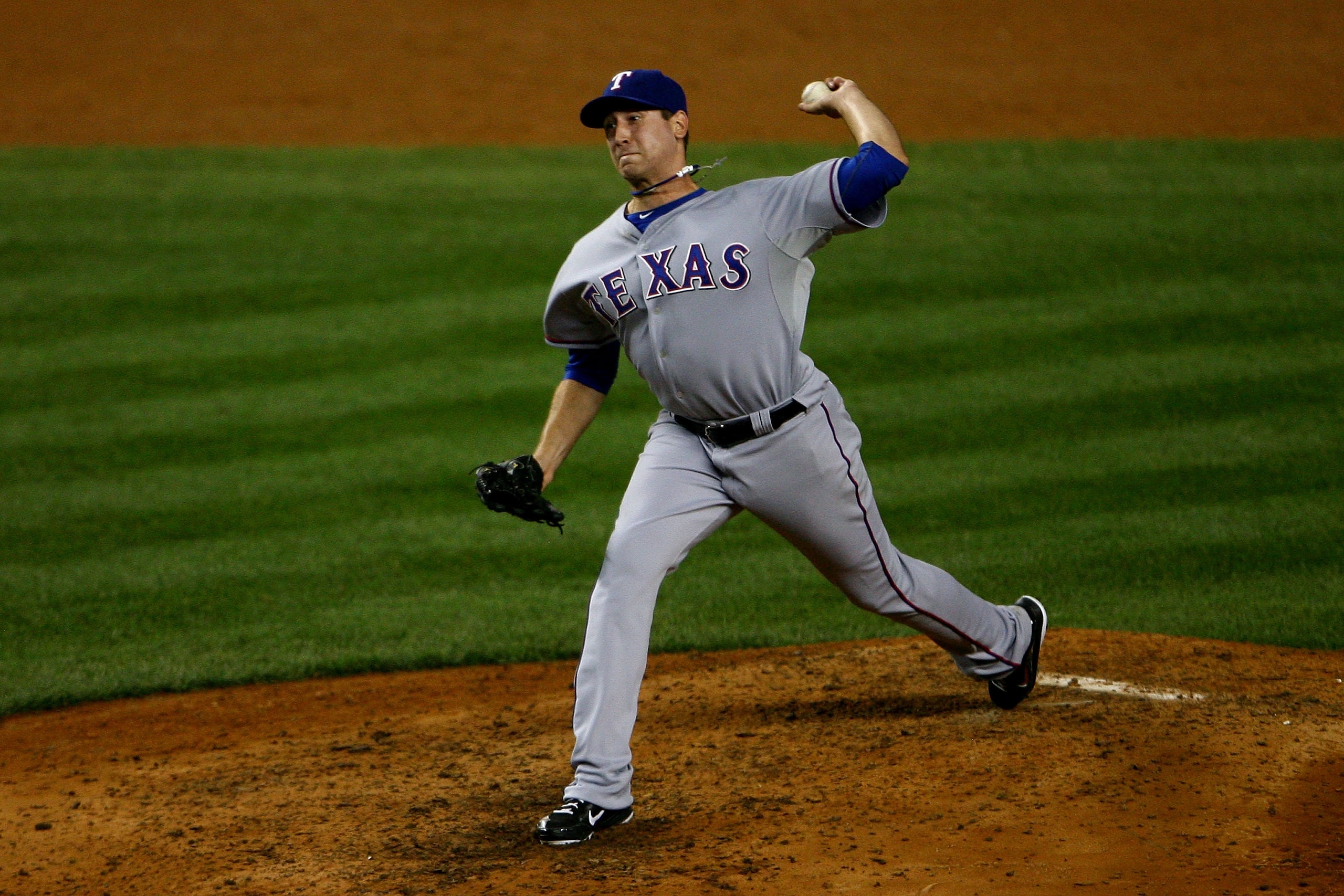 NEW YORK - OCTOBER 20:  Michael Kirkman #62 of the Texas Rangers pitches against the New York Yankees in Game Five of the ALCS during the 2010 MLB Playoffs at Yankee Stadium on October 20, 2010 in the Bronx borough of New York City.  (Photo by Andrew Burt