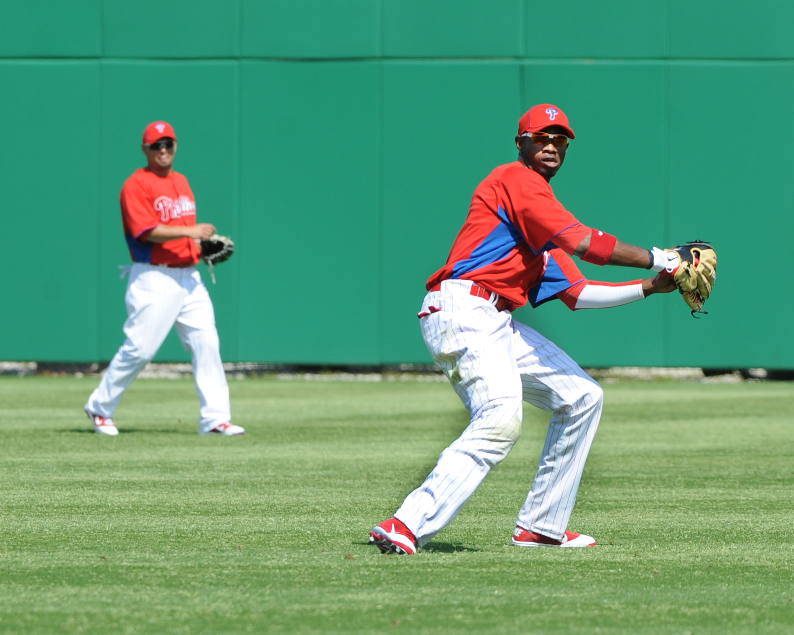 CLEARWATER, FL - FEBRUARY 24:  Outfielder Domonic Brown #9 of the Philadelphia Phillies fields a ball in right field against the Florida State Seminoles February 24, 2011 at Bright House Field in Clearwater, Florida.  (Photo by Al Messerschmidt/Getty Imag