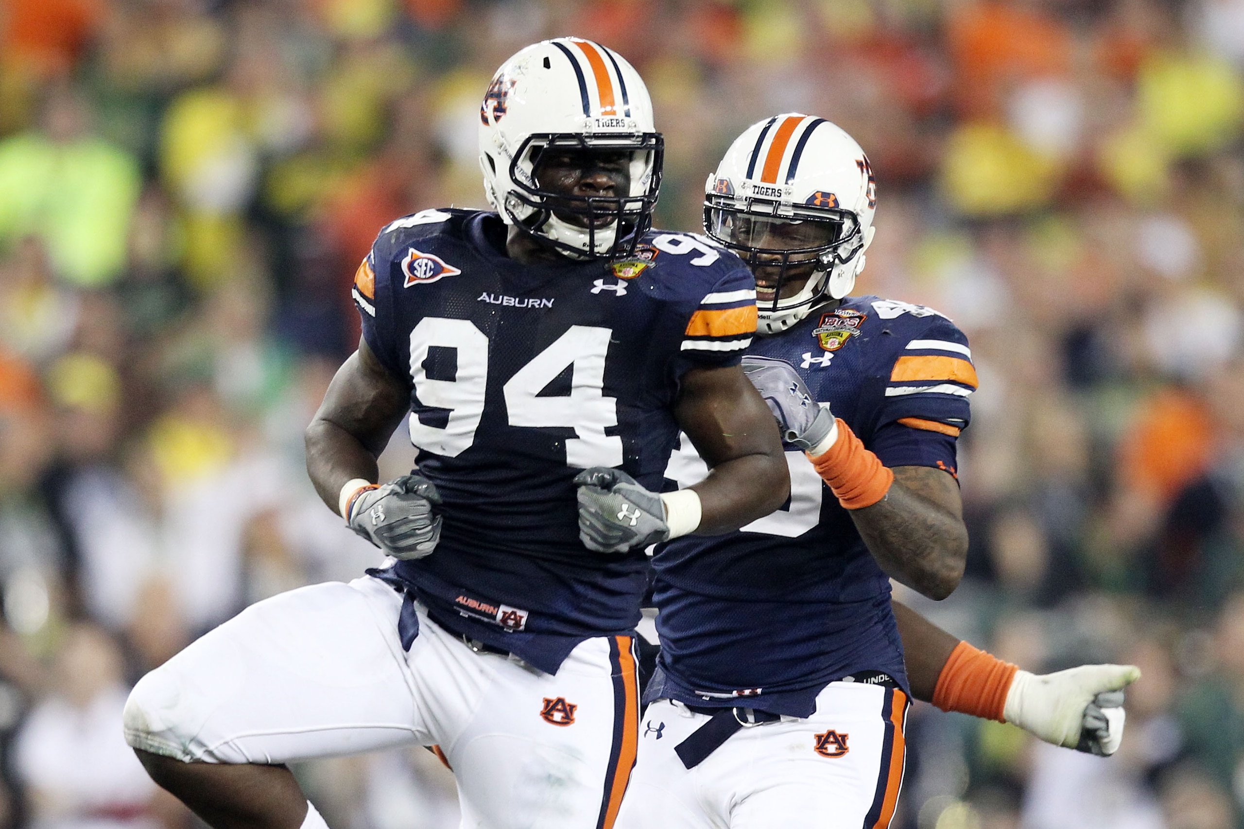 GLENDALE, AZ - JANUARY 10:  Nosa Eguae #94 and Antoine Carter #45 of the Auburn Tigers celebrate against the Oregon Ducks during the Tostitos BCS National Championship Game at University of Phoenix Stadium on January 10, 2011 in Glendale, Arizona.  (Photo