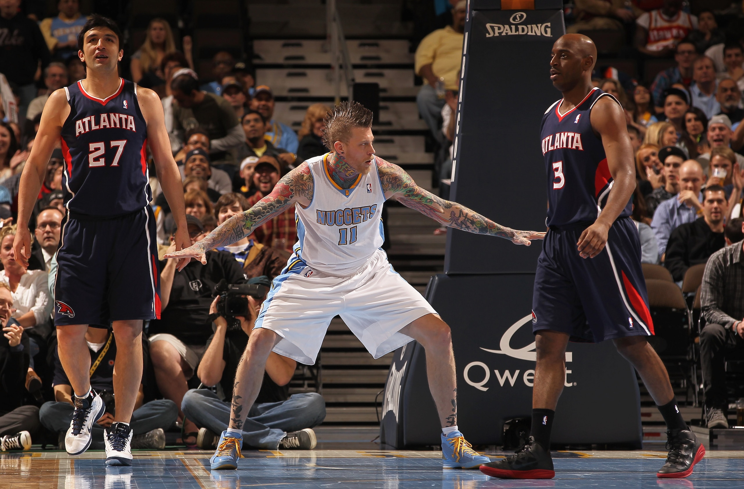 DENVER, CO - FEBRUARY 28:  Chris Andersen #11 of the Denver Nuggets reacts after blocking a shot by Zaza Pachulia #27 of the Atlanta Hawks as Damien Wilkins #3 of the Hawks looks on during NBA action at the Pepsi Center on February 28, 2011 in Denver, Col