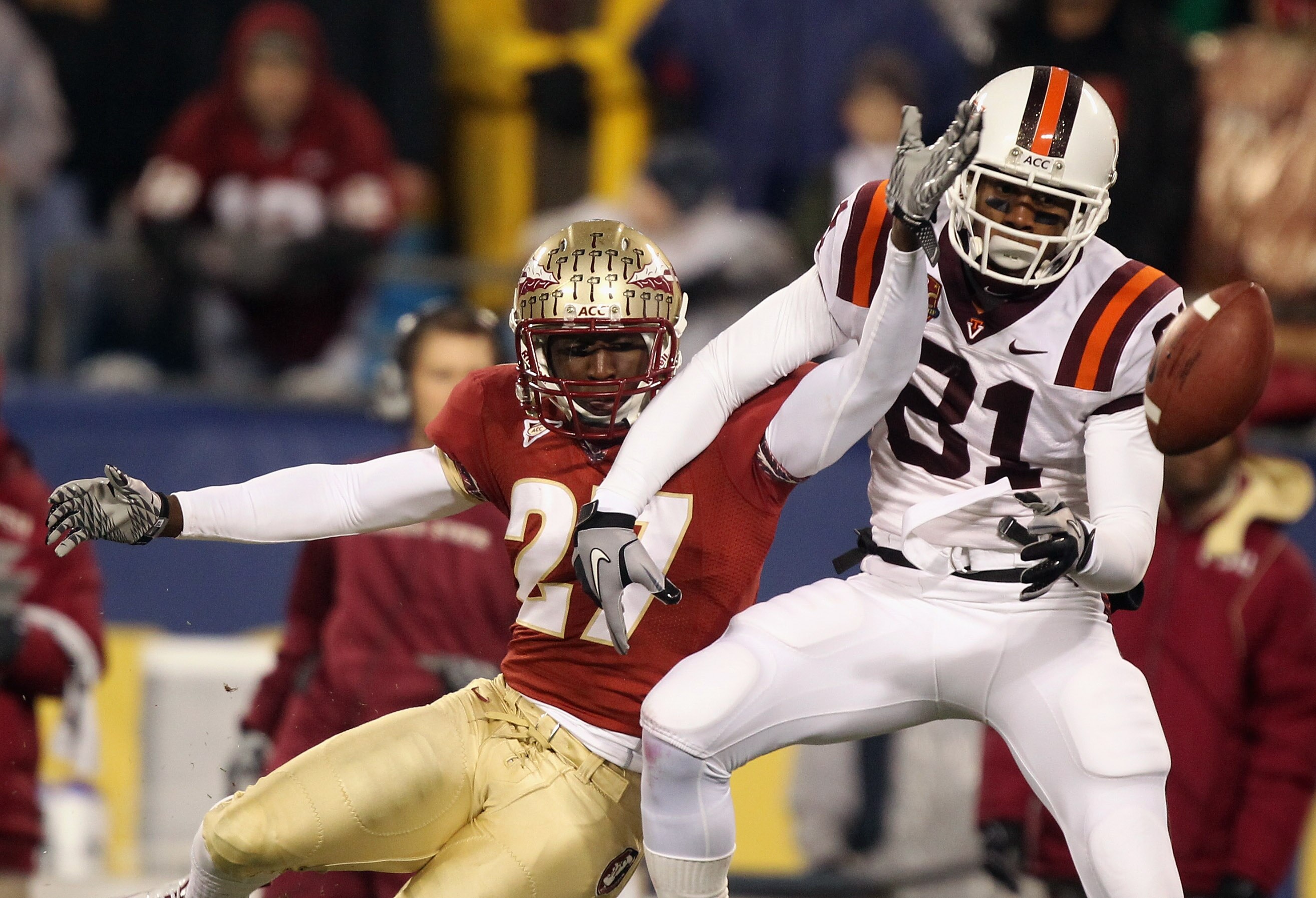 CHARLOTTE, NC - DECEMBER 04:  Xavier Rhodes #27 of the Florida State Seminoles breaks up a pass to Jarrett Boykin #81 of the Virginia Tech Hokies during their game at Bank of America Stadium on December 4, 2010 in Charlotte, North Carolina.  (Photo by Str