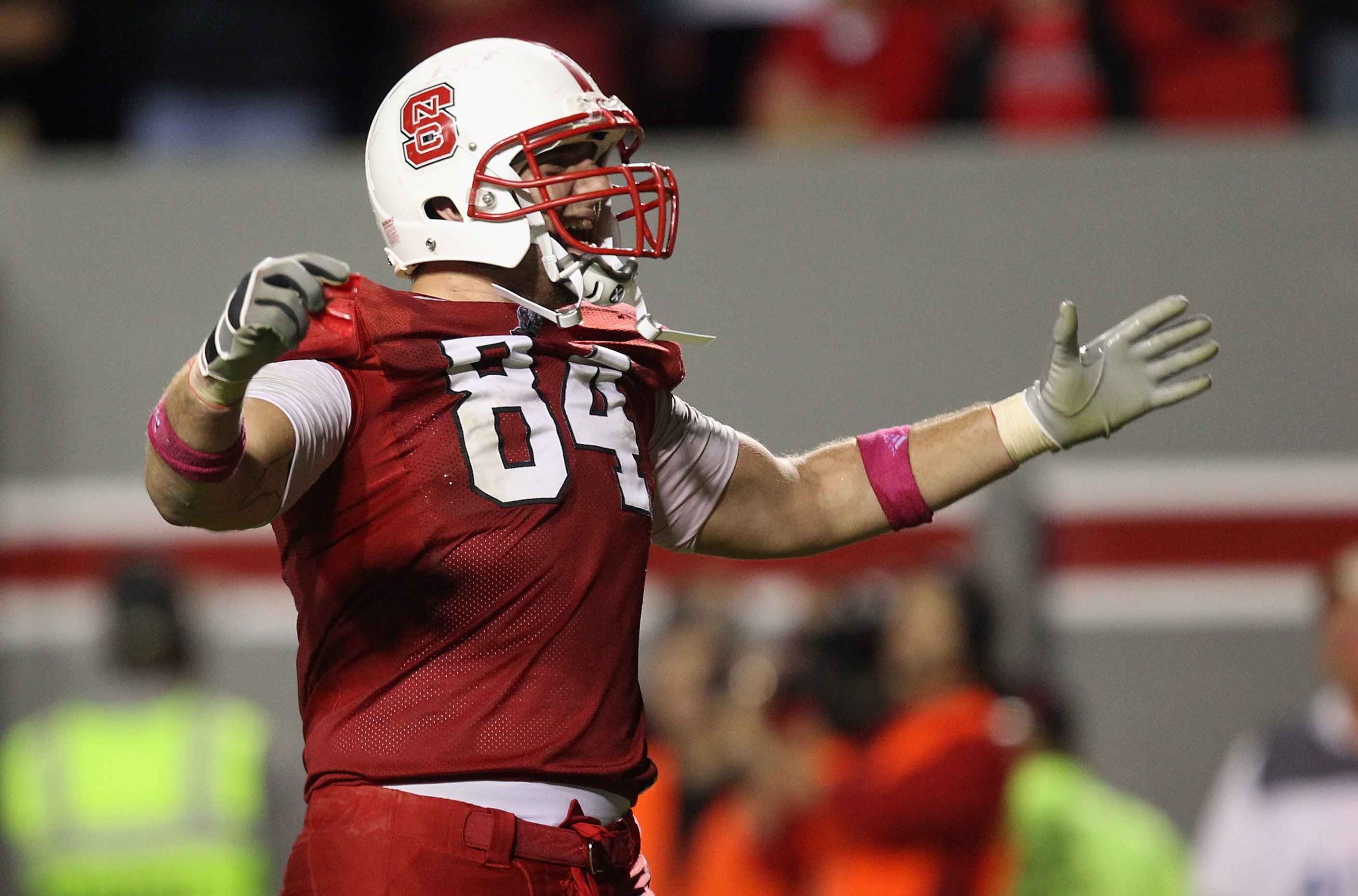 RALEIGH, NC - OCTOBER 28:  George Bryan #84 of the North Carolina State Wolfpack celebrates on his way to defeating the Florida State Seminoles 28-24 during their game at Carter-Finley Stadium on October 28, 2010 in Raleigh, North Carolina.  (Photo by Str