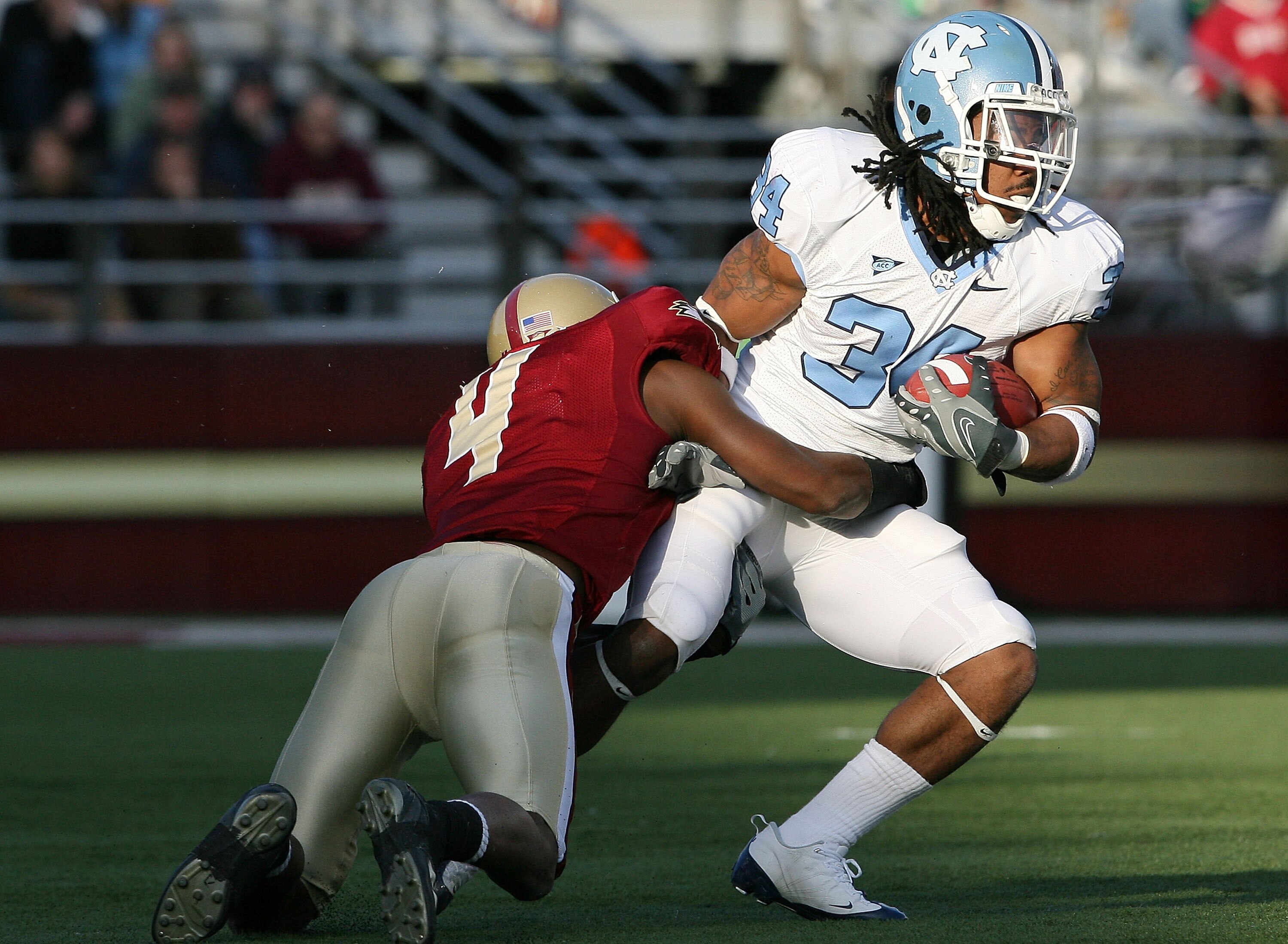 CHESTNUT HILL, MA - NOVEMBER 21:  Johnny White #34 of the North Carolina Tar Heels is tackled by Donnie Fletcher #4 of the Boston College Eagles on November 21, 2009 at Alumni Stadium in Chestnut Hill, Massachusetts. The Tar Heels defeated the Eagles 31-1