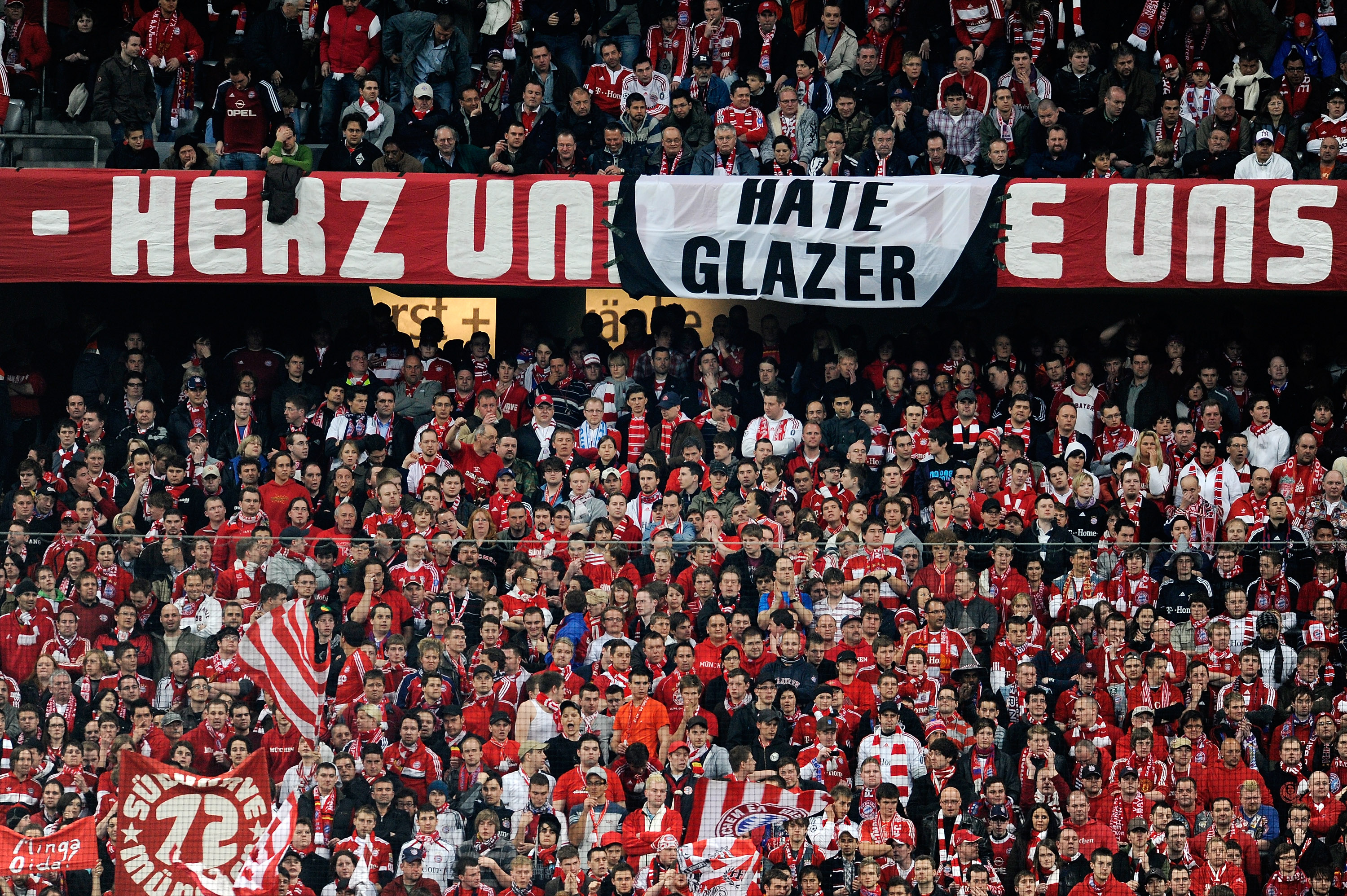 MUNICH, GERMANY - MARCH 30:  A sign displaying 'Hate Glazer' in among the Bayern fans during the UEFA Champions League quarter final first leg match between Bayern Muenchen and Manchester United at the Allianz Arena on March 30, 2010 in Munich, Germany.