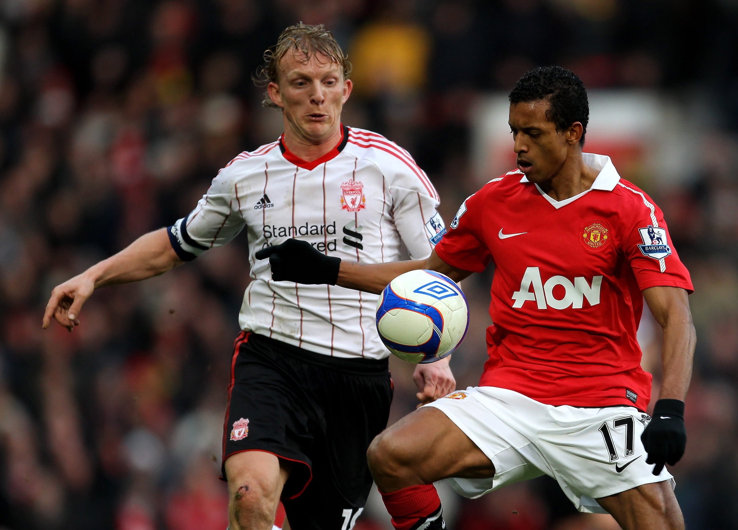 MANCHESTER, ENGLAND - JANUARY 09:  Dirk Kuyt of Liverpool competes with Nani of Manchester United during the FA Cup sponsored by E.ON 3rd round match between Manchester United and Liverpool at Old Trafford on January 9, 2011 in Manchester, England. (Photo