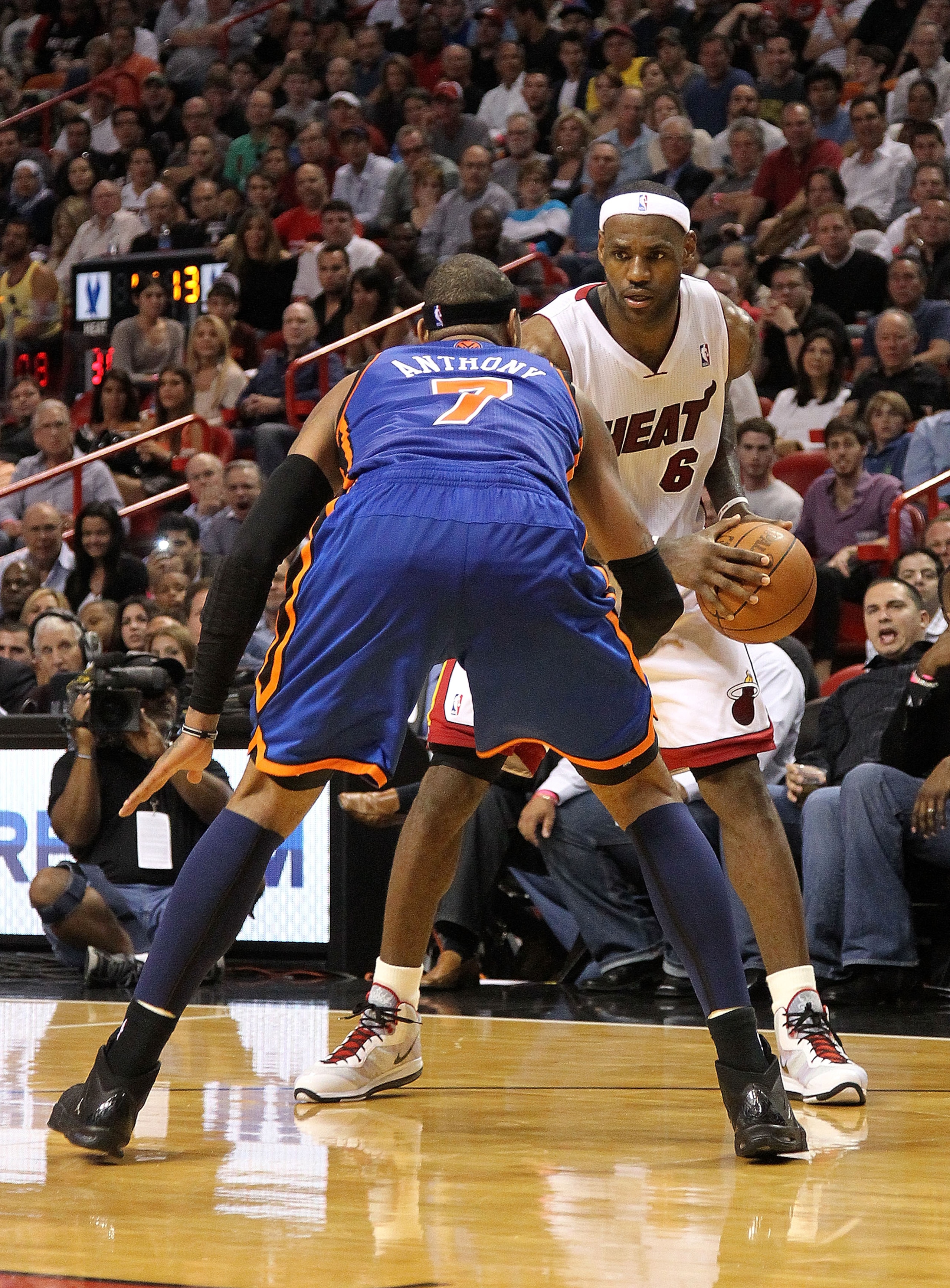 MIAMI, FL - FEBRUARY 27:  LeBron James #6 of the Miami Heat is guarded by Carmelo Anthony #7 of the New York Knicks during a game at American Airlines Arena on February 27, 2011 in Miami, Florida. NOTE TO USER: User expressly acknowledges and agrees that,