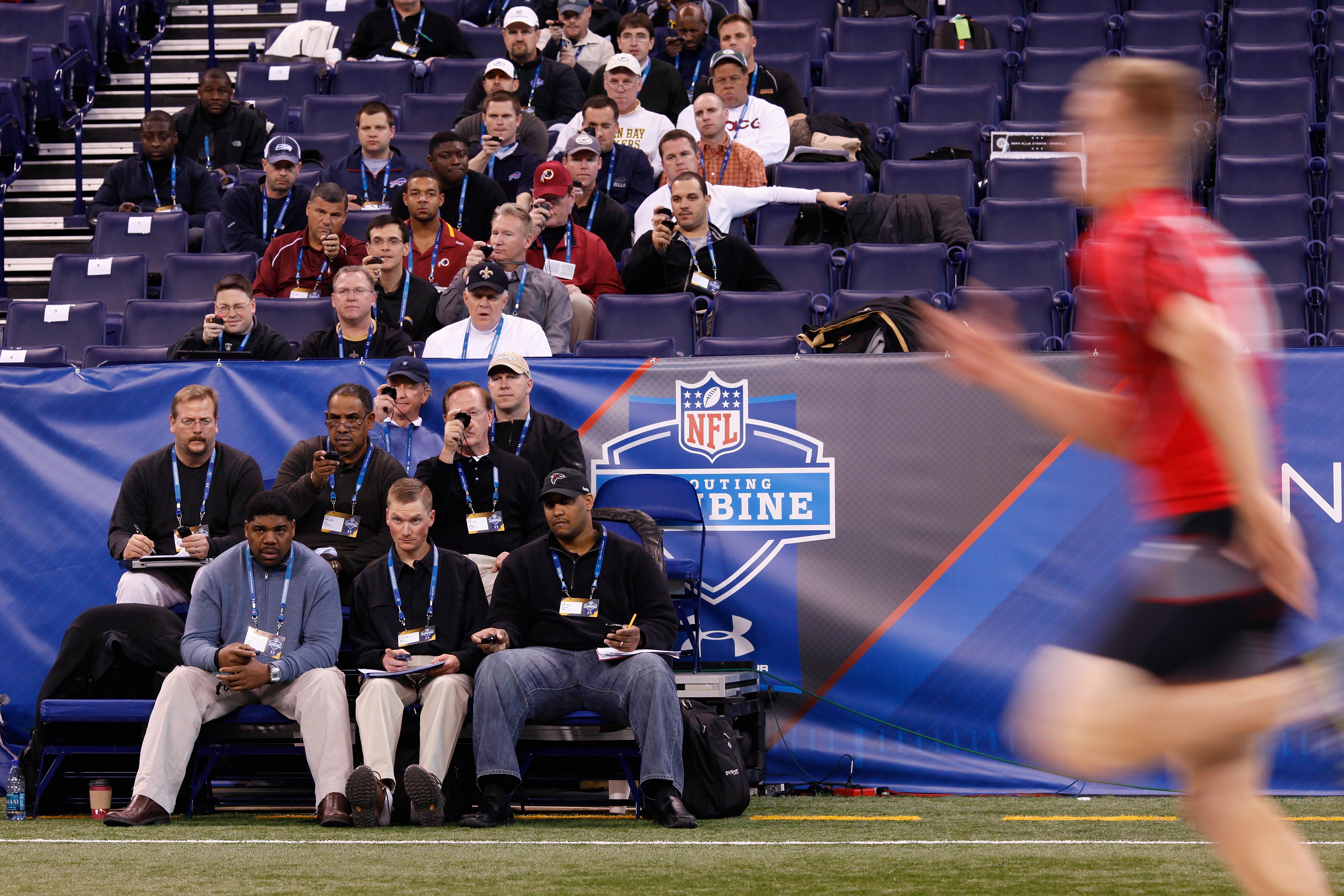 INDIANAPOLIS, IN - FEBRUARY 27: Team personnel record times in the 40-yard dash during the 2011 NFL Scouting Combine at Lucas Oil Stadium on February 27, 2011 in Indianapolis, Indiana. (Photo by Joe Robbins/Getty Images)