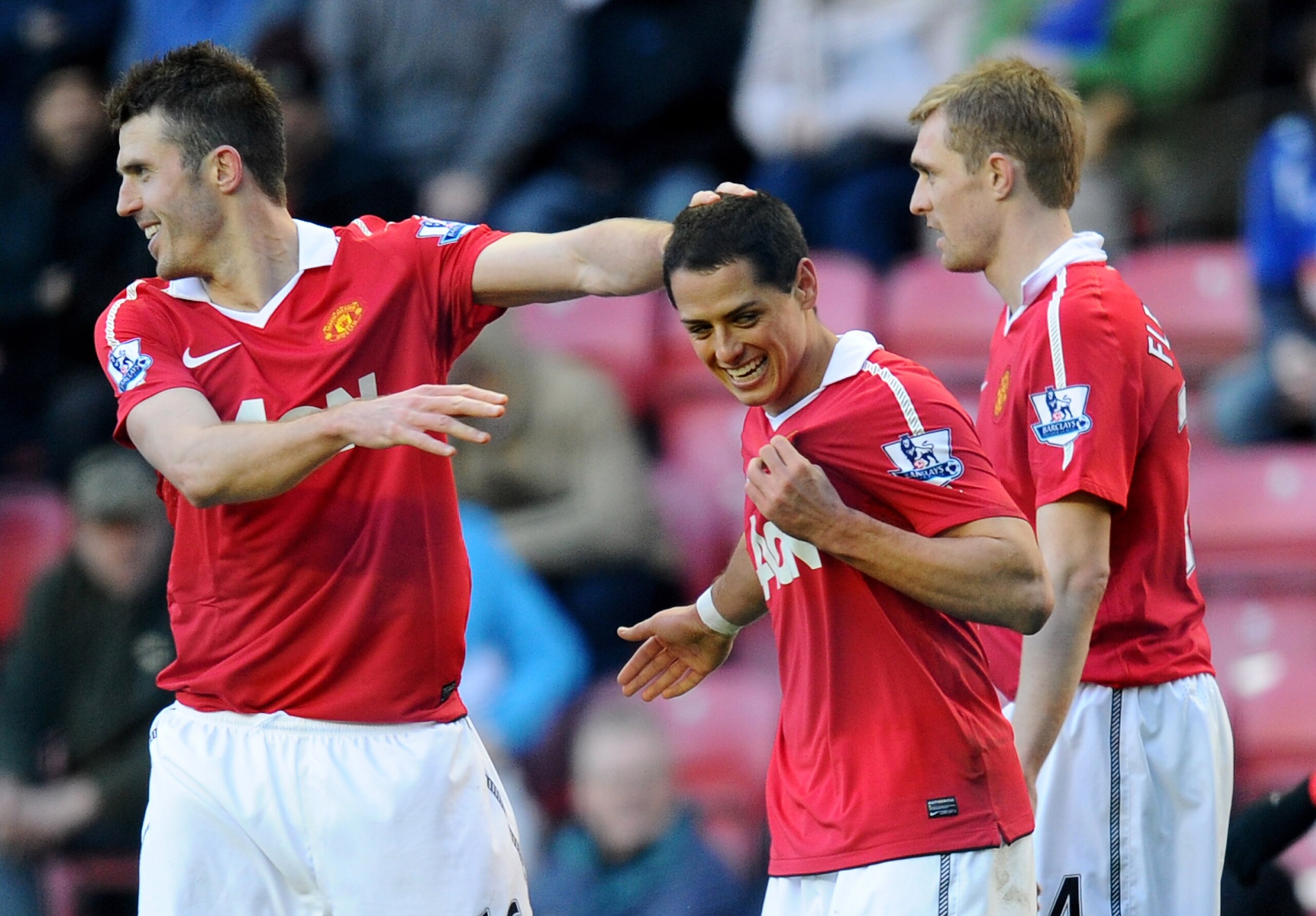 WIGAN, ENGLAND - FEBRUARY 26: Chicharito of Manchester United celebrates scoring his team's second goal with team mate Michael Carrick (L) during the Barclays Premier League match between Wigan Athletic and Manchester United at the DW Stadium on February WIGAN, ENGLAND - FEBRUARY 26: Chicharito of Manchester United celebrates scoring his team's second goal with team mate Michael Carrick (L) during the Barclays Premier League match between Wigan Athletic and Manchester United at the DW Stadium on February
