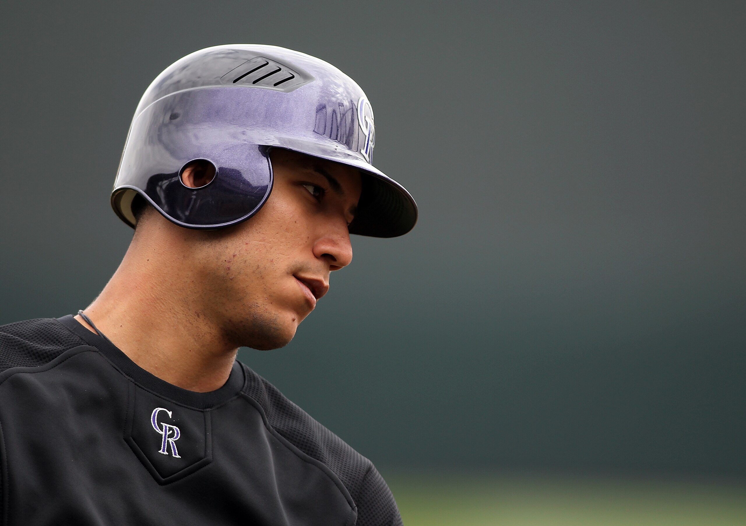 SCOTTSDALE, AZ - FEBRUARY 26: Carlos Gonzalez #5 of the Colorado Rockies watches batting practice before the game against the Arizona Diamondbacks at Salt River Fields on February 26, 2011in Scottsdale, Arizona.. (Photo by Jonathan Ferrey/Getty Images) SCOTTSDALE, AZ - FEBRUARY 26: Carlos Gonzalez #5 of the Colorado Rockies watches batting practice before the game against the Arizona Diamondbacks at Salt River Fields on February 26, 2011in Scottsdale, Arizona.. (Photo by Jonathan Ferrey/Getty Images)