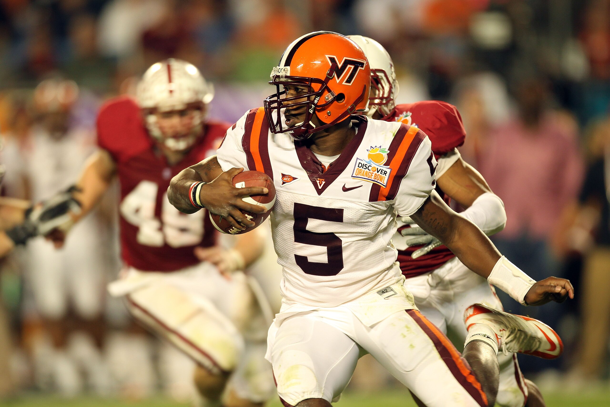 MIAMI, FL - JANUARY 03:  Quarterback Tyrod Taylor #5 of the Virginia Tech Hokies runs with the ball against the Stanford Cardinal during the 2011 Discover Orange Bowl at Sun Life Stadium on January 3, 2011 in Miami, Florida. Stanford won 40-12. (Photo by