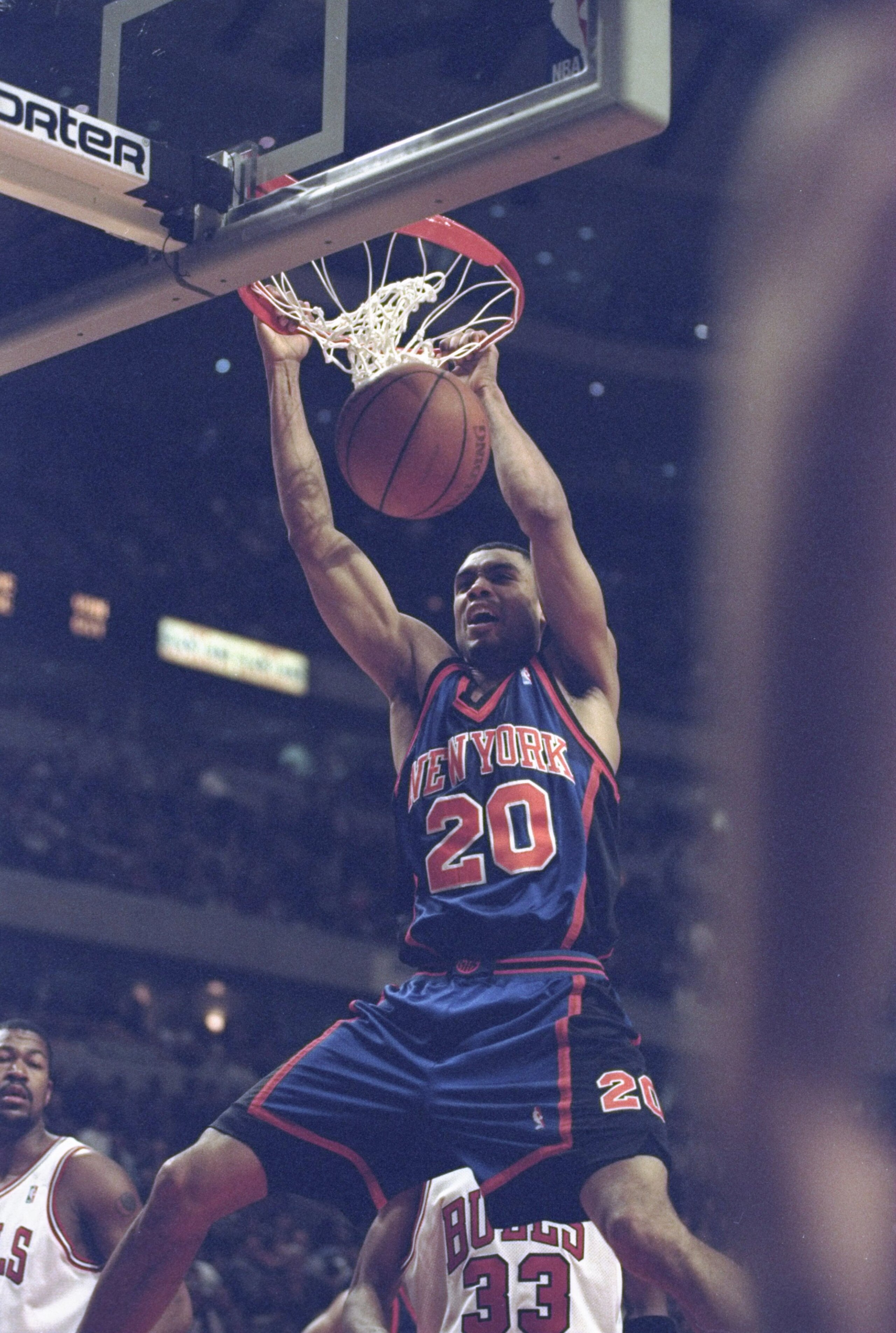 18 Apr 1998:  Allan Houston #20 of the New York Knicks slam dunks the ball during a game against the Chicago Bulls at the United Center in Chicago, Illinois. The Bulls defeated the Knicks 111-109. Mandatory Credit: Jonathan Daniel  /Allsport