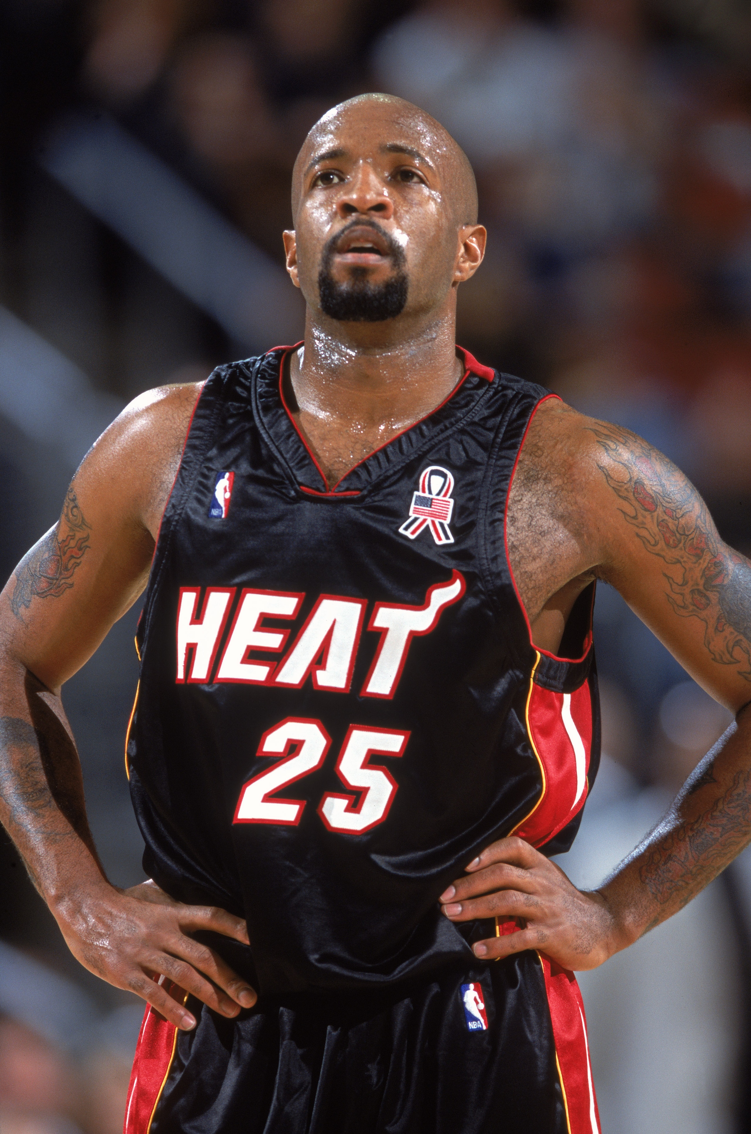 7 Dec 2001:  Point guard Anthony Carter #25 of the Miami Heat rests during the NBA game against the Seattle SuperSonics at Key Arena in Seattle, Washington. The Heat defeated the SuperSonics 98-94.Mandatory Credit:  Otto Greule/Getty Images