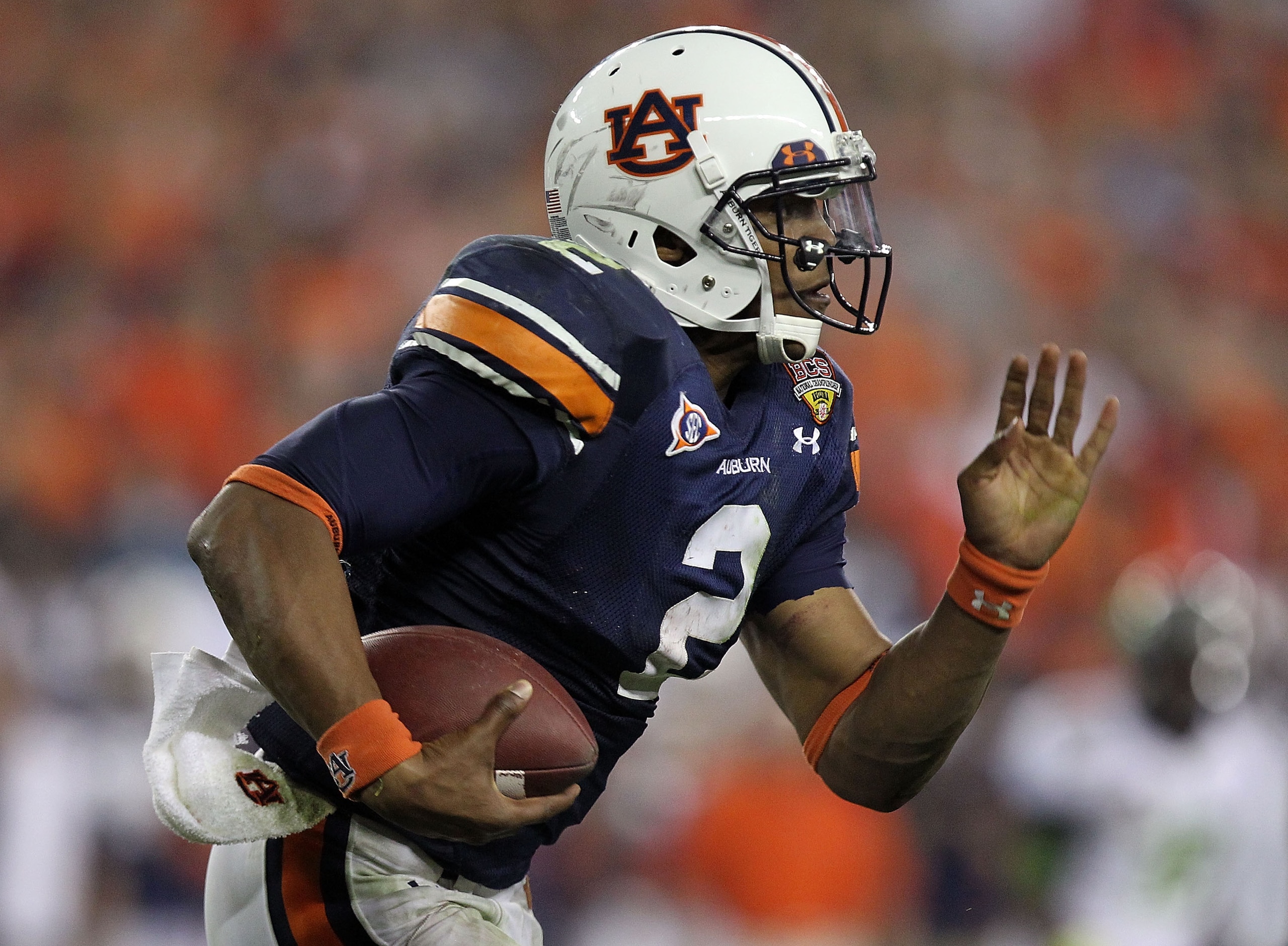 GLENDALE, AZ - JANUARY 10:  Quarterback Cameron Newton #2 of the Auburn Tigers runs the ball in the third quarter against the Oregon Ducks during the Tostitos BCS National Championship Game at University of Phoenix Stadium on January 10, 2011 in Glendale,