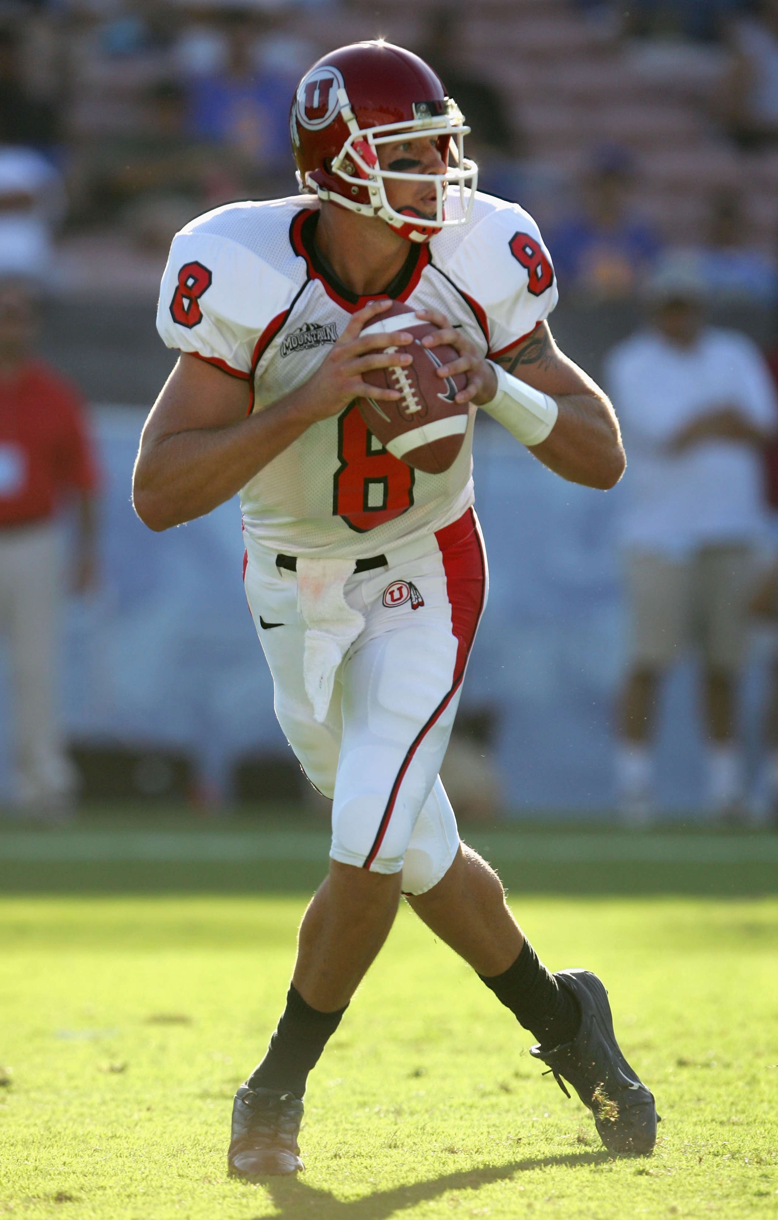 PASADENA, CA - SEPTEMBER 02:  Tommy Grady #8 of the Utah Utes drops back to pass against the UCLA Bruins during the college football game held on Septemeber 2, 2006 at the Rose Bowl in Pasadena, California. The Bruins defeated the Utes 31-10.  (Photo by J