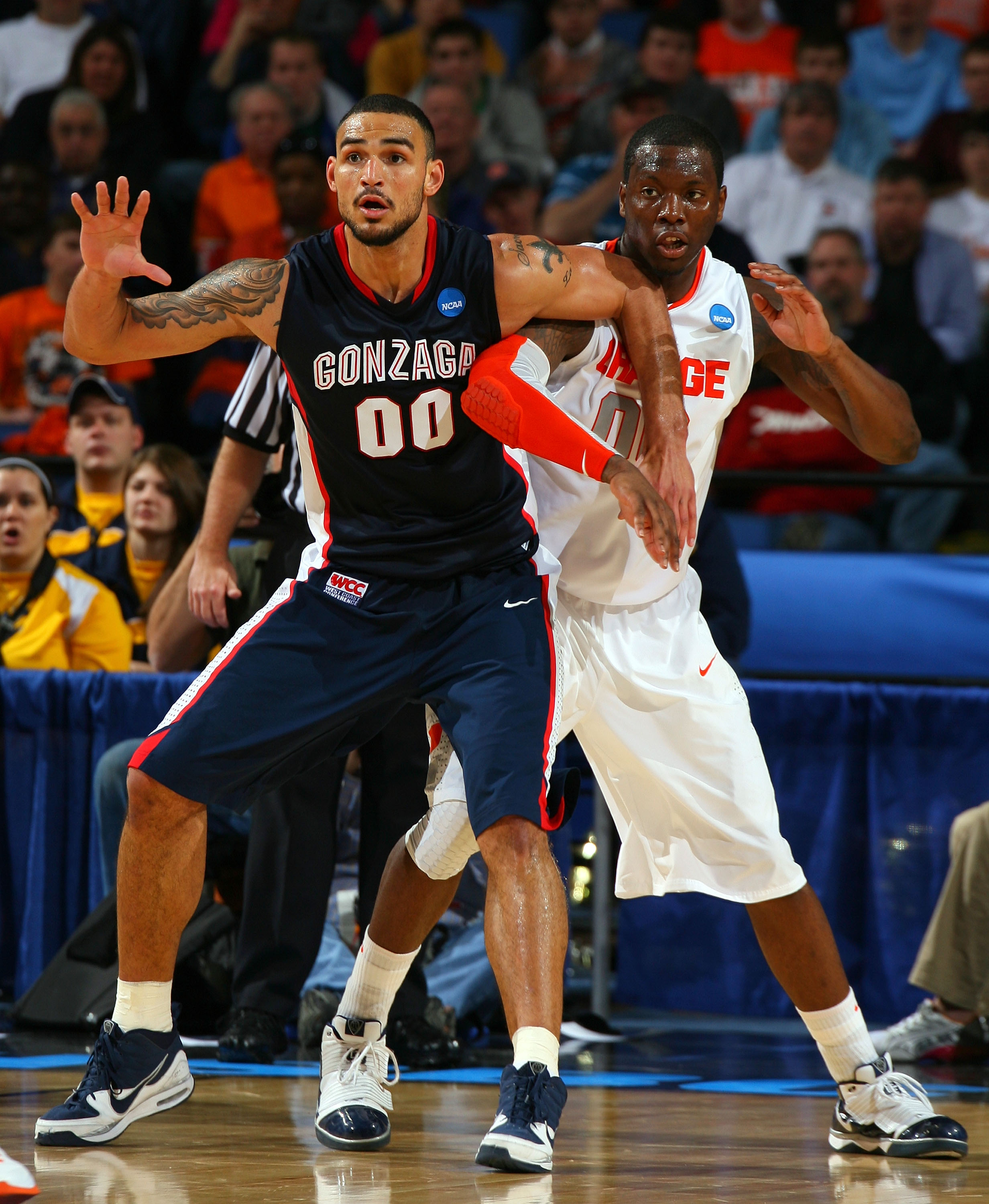 BUFFALO, NY - MARCH 21:  Rick Jackson #00 of the Syracuse Orange fights for position against Robert Sacre #00 of the Gonzaga Bulldogs during the second round of the 2010 NCAA men's basketball tournament at HSBC Arena at HSBC Arena on March 21, 2010 in Buf