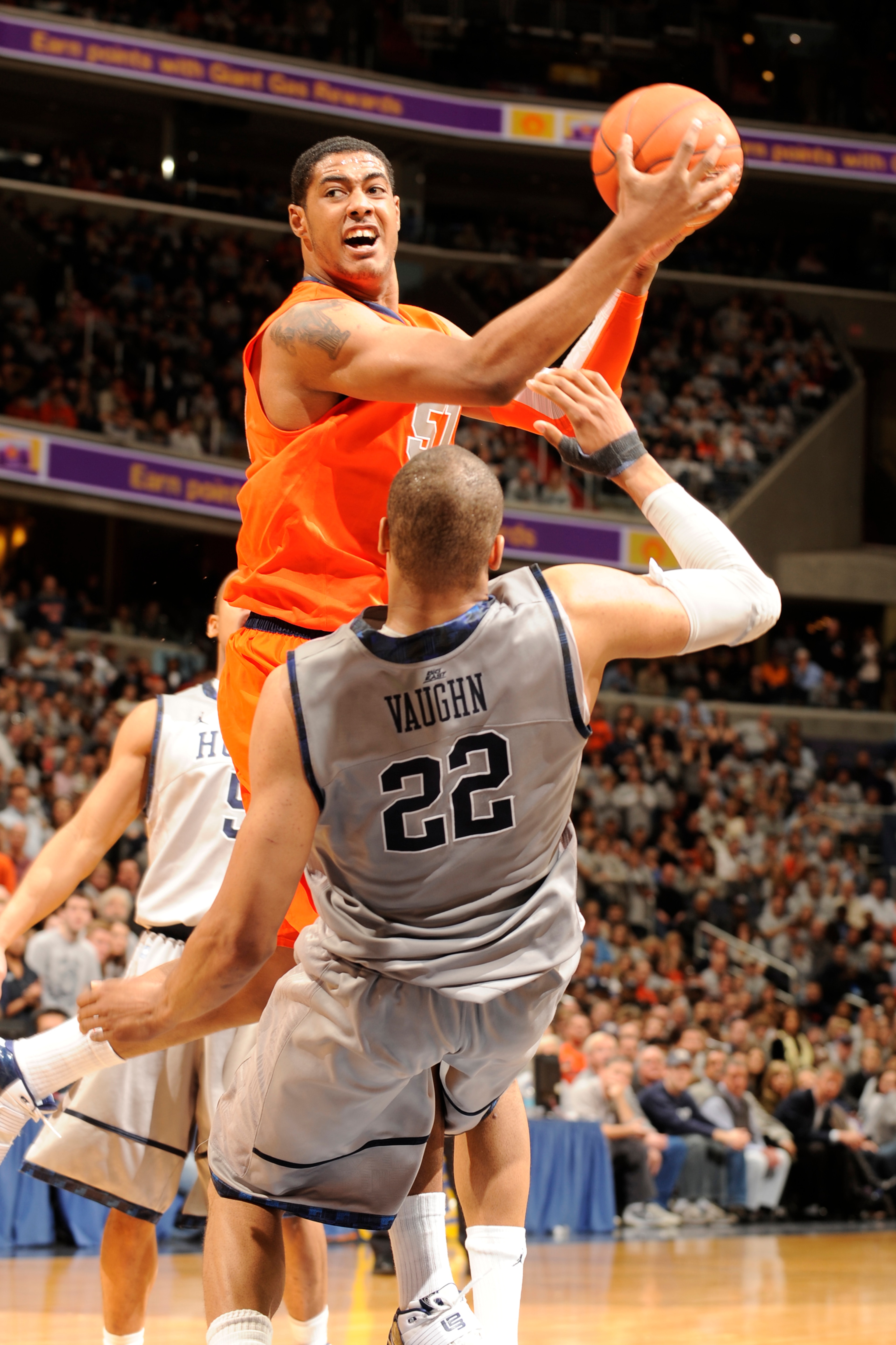 WASHINGTON, DC - FEBRUARY 26: Fab Melo #51 of the Syracuse Orange takes a shot over Julian Vaughn #22 of the Georgetown Hoyas during a college basketball game on February 26, 2011 at the Verizon Center in Washington, DC The Orange 58-51. (Photo by Mitc WASHINGTON, DC - FEBRUARY 26: Fab Melo #51 of the Syracuse Orange takes a shot over Julian Vaughn #22 of the Georgetown Hoyas during a college basketball game on February 26, 2011 at the Verizon Center in Washington, DC The Orange 58-51. (Photo by Mitc