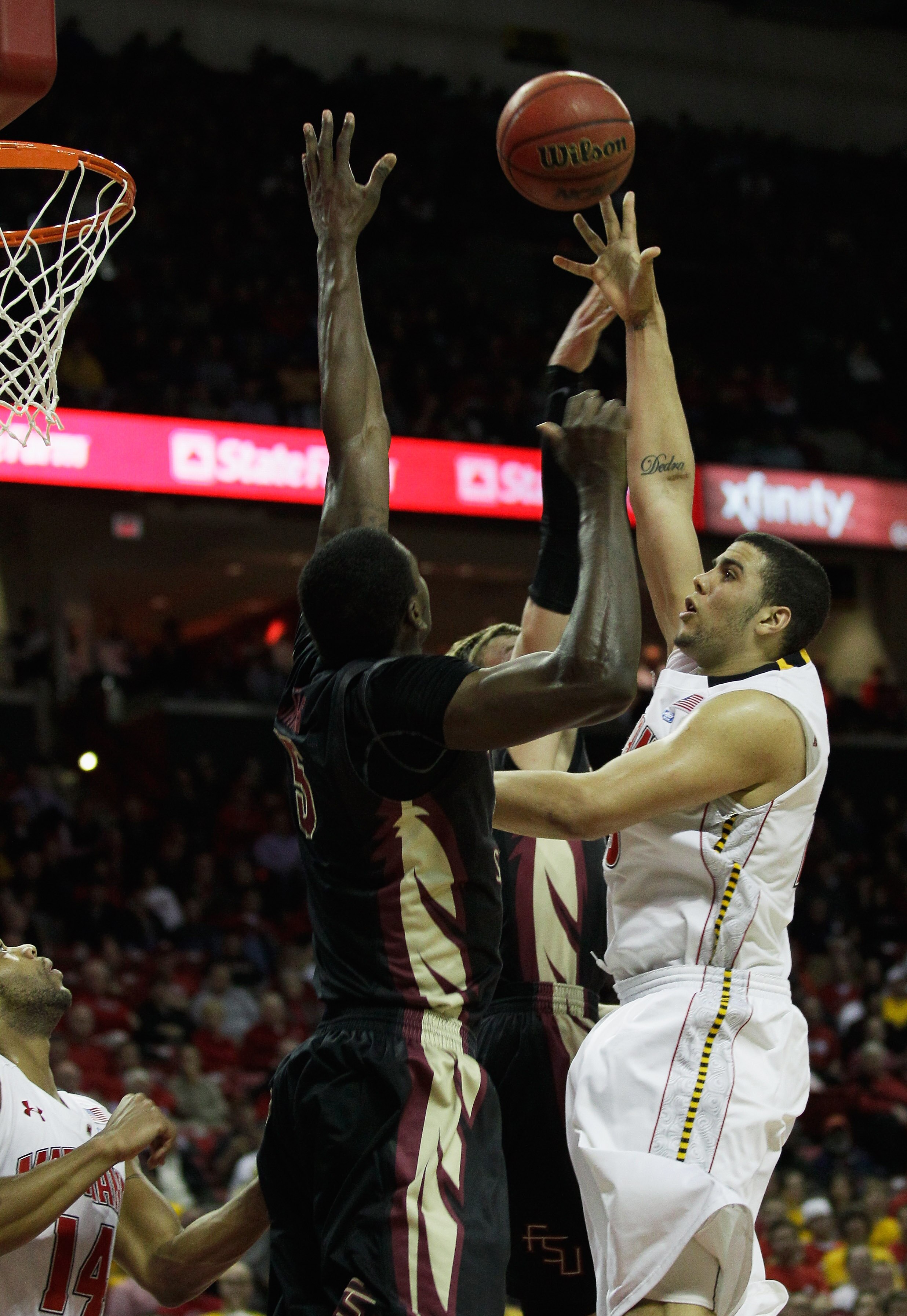 COLLEGE PARK, MD - FEBRUARY 23: Jordan Williams, right, of the Maryland Terrapins puts up a shot over Bernard James #5 of the Florida State Seminoles at the Comast Center on February 23, 2011 in College Park, Maryland.  (Photo by Rob Carr/Getty Images)