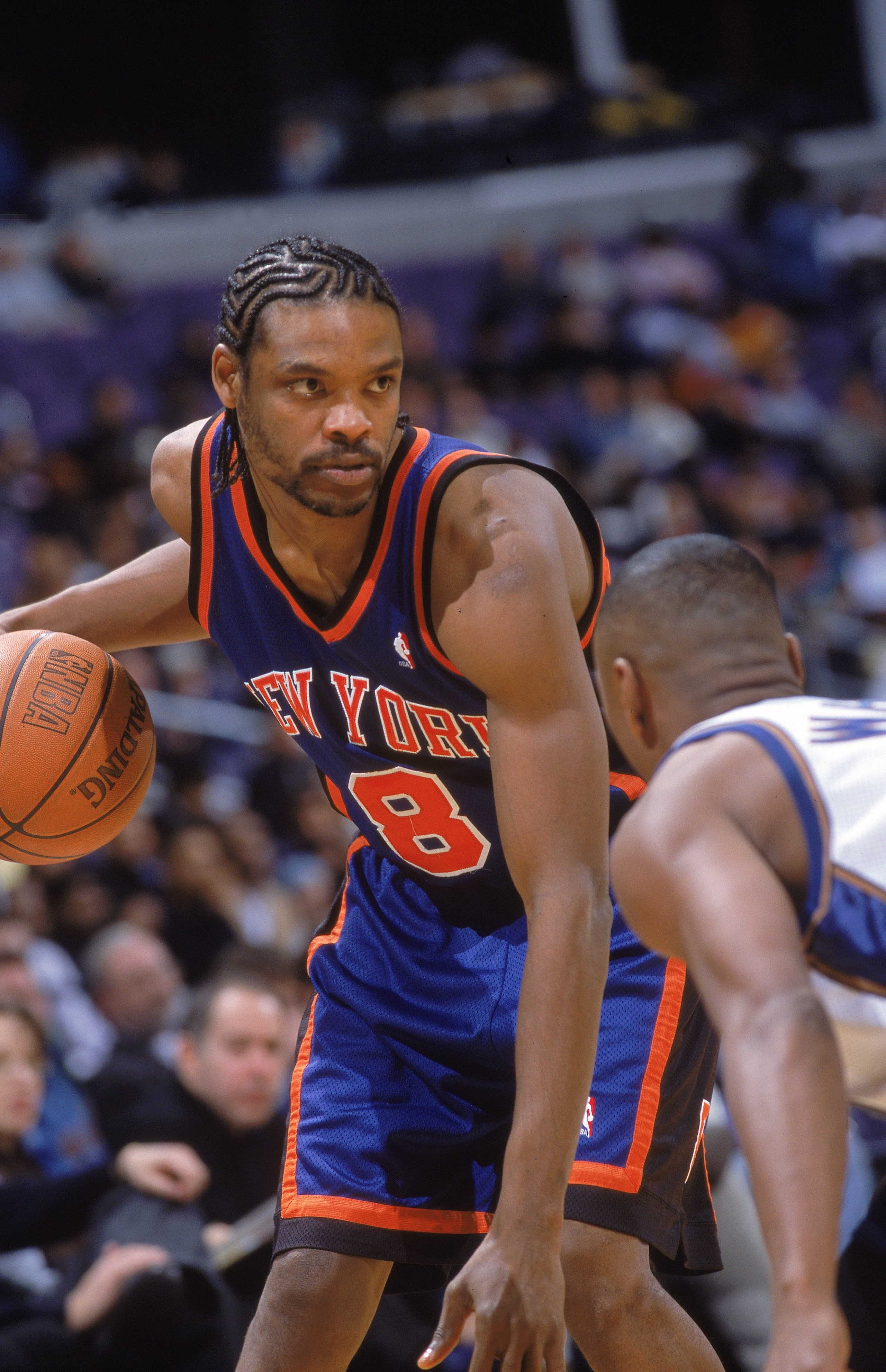 27 Dec 2000:  Latrell Sprewell #8 of the New York Knicks dribbles the ball as he looks to move during the game against the Washington Wizards at the MCI Center in Washingotn, DC.  The Knicks defeated the Wizards 89-82.NOTE TO USER: It is expressly underst