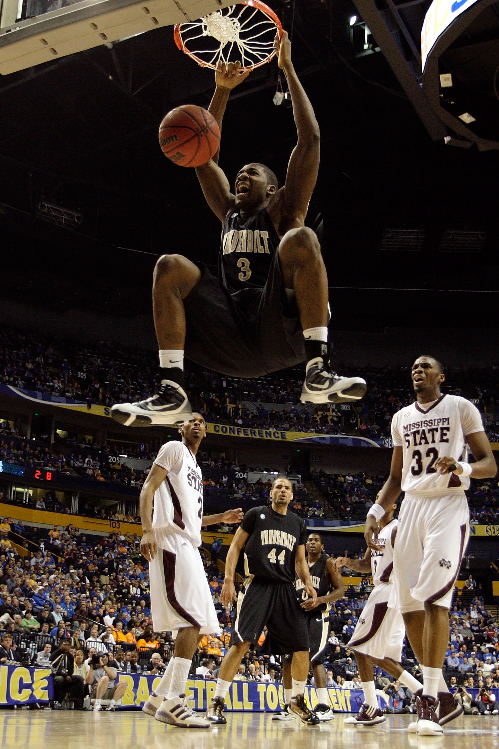 NASHVILLE, TN - MARCH 13:  Festus Ezeli #3 of the Vanderbilt Commodores dunks against the Mississippi State Bulldogs during the semirfinals of the SEC Men's Basketball Tournament at the Bridgestone Arena on March 13, 2010 in Nashville, Tennessee.  (Photo