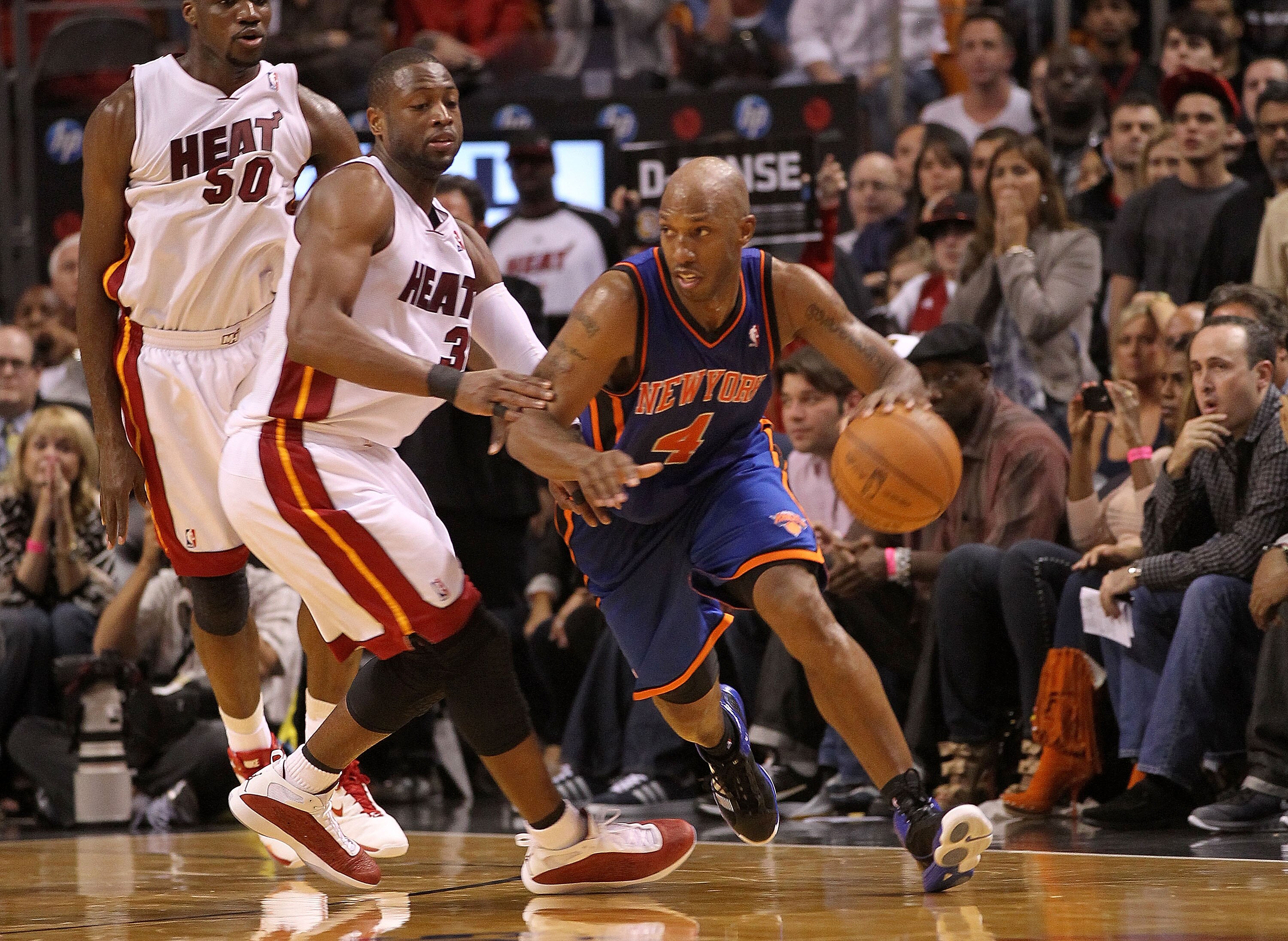 MIAMI, FL - FEBRUARY 27:  Chauncey Billups #4 of the New York Knicks drives past Dwyane Wade #3 of the Miami Heat during a game at American Airlines Arena on February 27, 2011 in Miami, Florida. NOTE TO USER: User expressly acknowledges and agrees that, b
