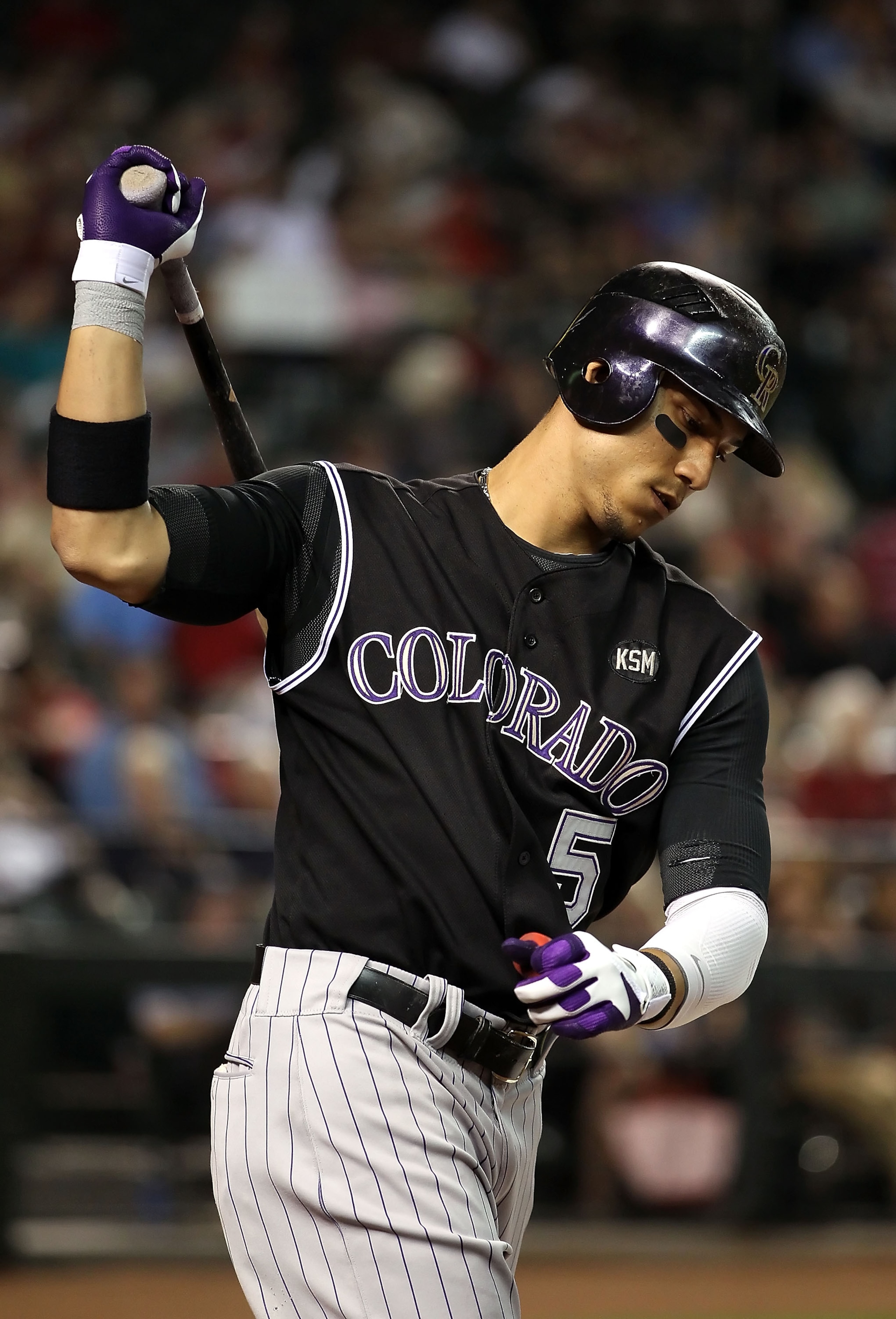 PHOENIX - SEPTEMBER 21: Carlos Gonzalez #5 of the Colorado Rockies warms up on deck during the Major League Baseball game against the Arizona Diamondbacks at Chase Field on September 21, 2010 in Phoenix, Arizona. (Photo by Christian Petersen/Getty Image PHOENIX - SEPTEMBER 21: Carlos Gonzalez #5 of the Colorado Rockies warms up on deck during the Major League Baseball game against the Arizona Diamondbacks at Chase Field on September 21, 2010 in Phoenix, Arizona. (Photo by Christian Petersen/Getty Image