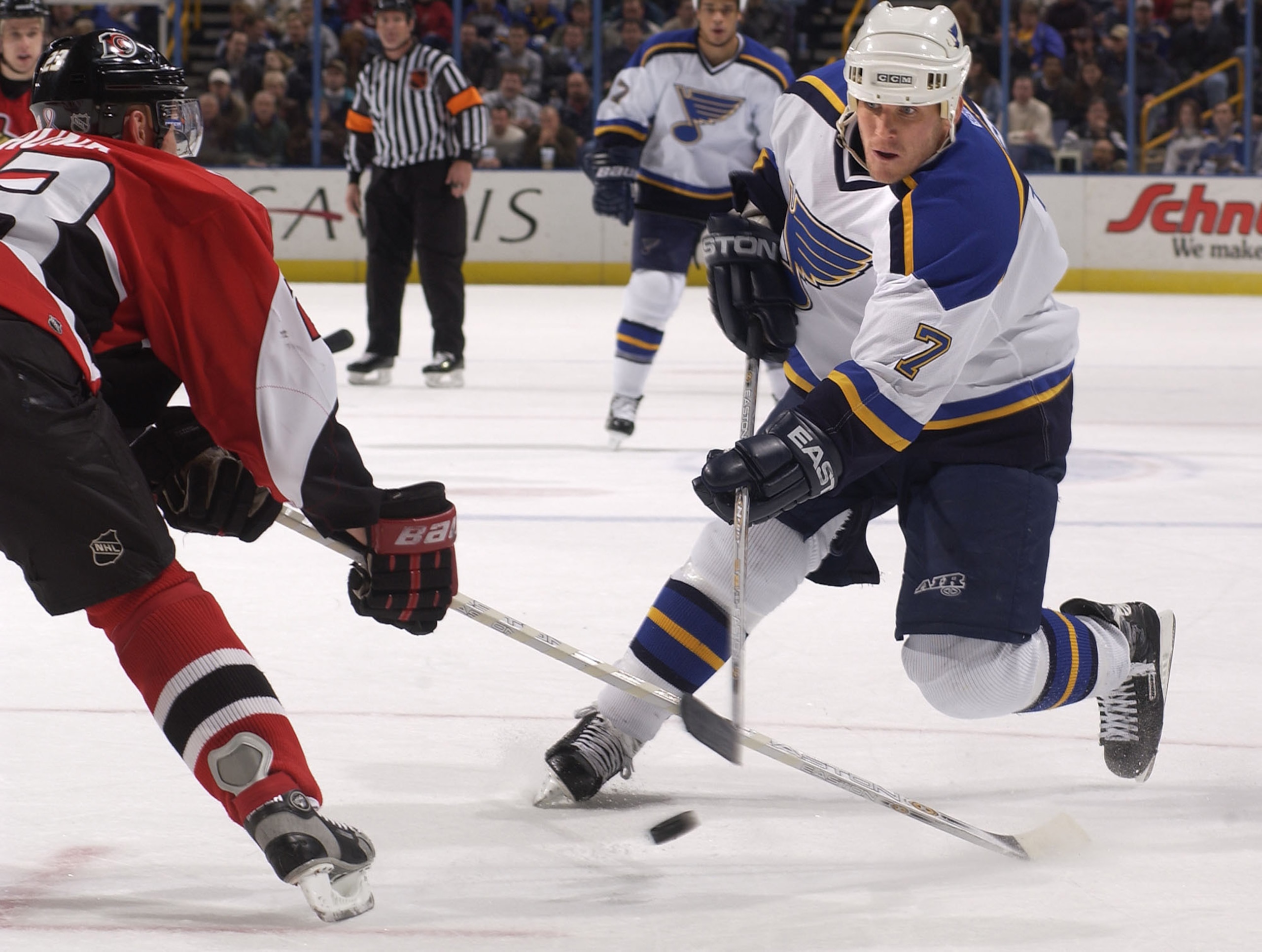 27 Nov 2001: Keith Tkachuk #7 of the St. Louis Blues takes a shot as Karel Rachunek #23 of the Ottawa Senators defends during the first period at the Savvis Center in St.Louis, Missouri. DIGITAL IMAGE. Mandatory Credit: Elsa/ALLSPORT