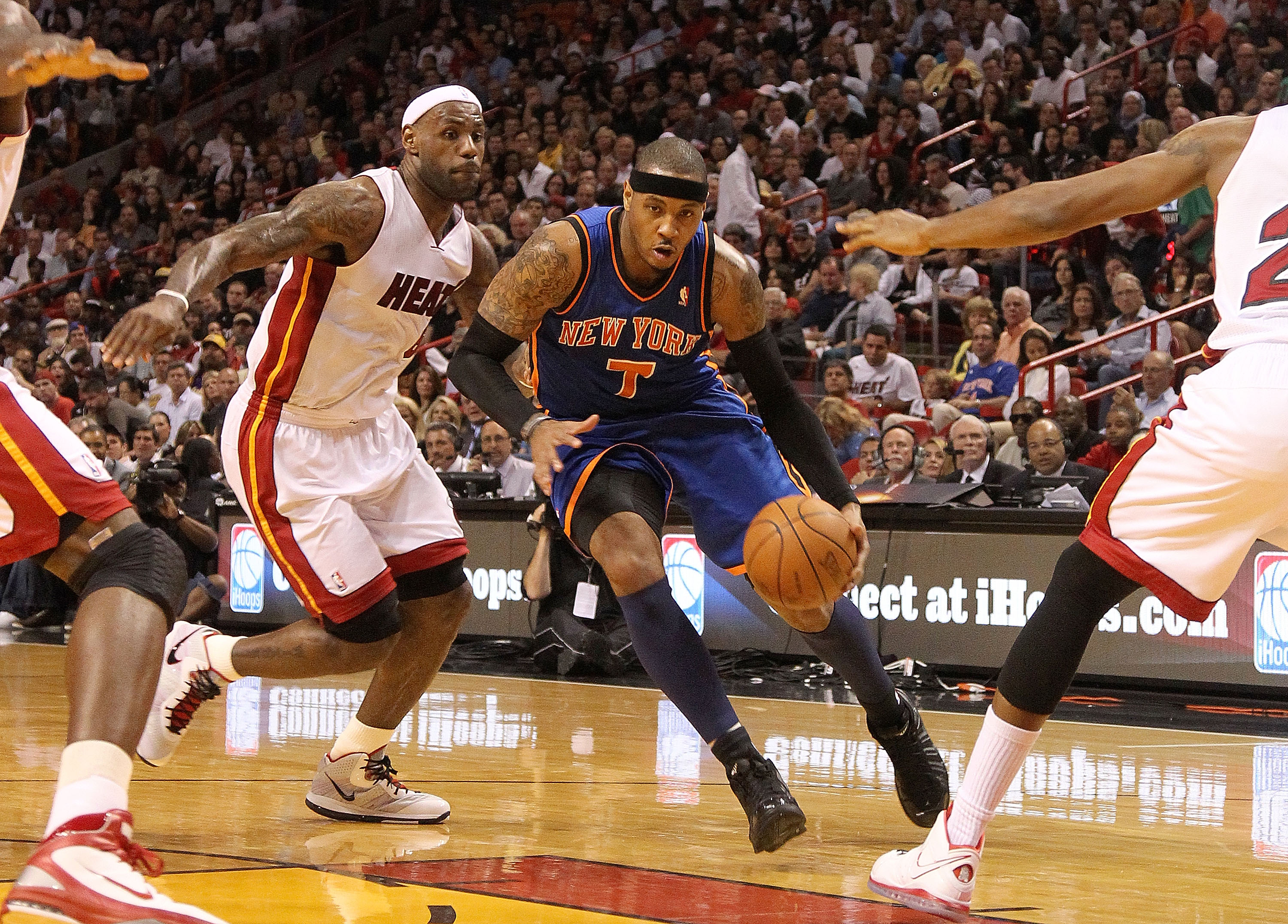 MIAMI, FL - FEBRUARY 27:  Carmelo Anthony #7 of the New York Knicks drives past LeBron James #6 of the Miami Heat during a game at American Airlines Arena on February 27, 2011 in Miami, Florida. NOTE TO USER: User expressly acknowledges and agrees that, b