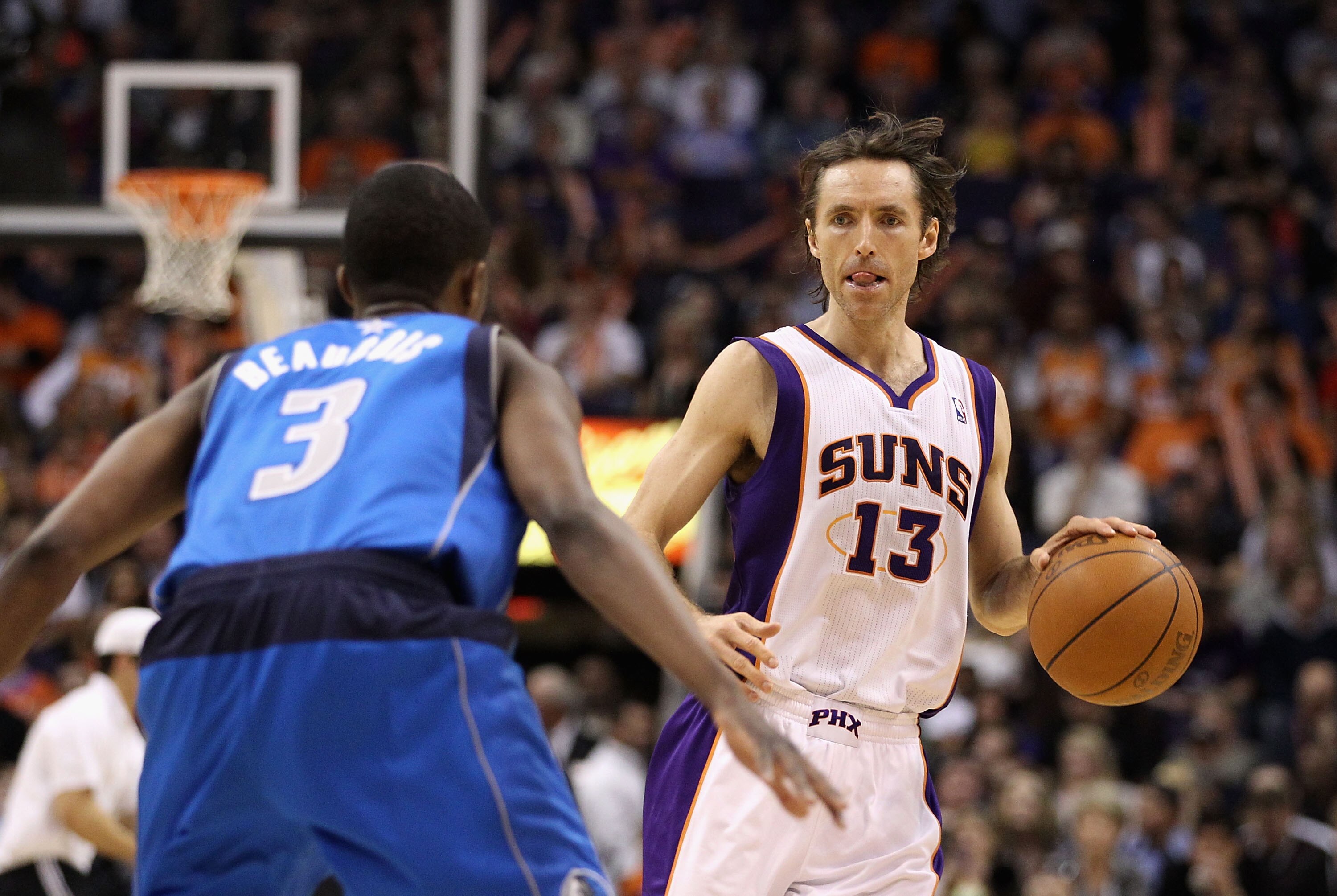 PHOENIX, AZ - FEBRUARY 17: Steve Nash #13 of the Phoenix Suns during the NBA game against the Dallas Mavericks at US Airways Center on February 17, 2011 in Phoenix, Arizona. The Mavericks defeated the Suns 112-106. NOTE TO USER: User expressly acknowle PHOENIX, AZ - FEBRUARY 17: Steve Nash #13 of the Phoenix Suns during the NBA game against the Dallas Mavericks at US Airways Center on February 17, 2011 in Phoenix, Arizona. The Mavericks defeated the Suns 112-106. NOTE TO USER: User expressly acknowle