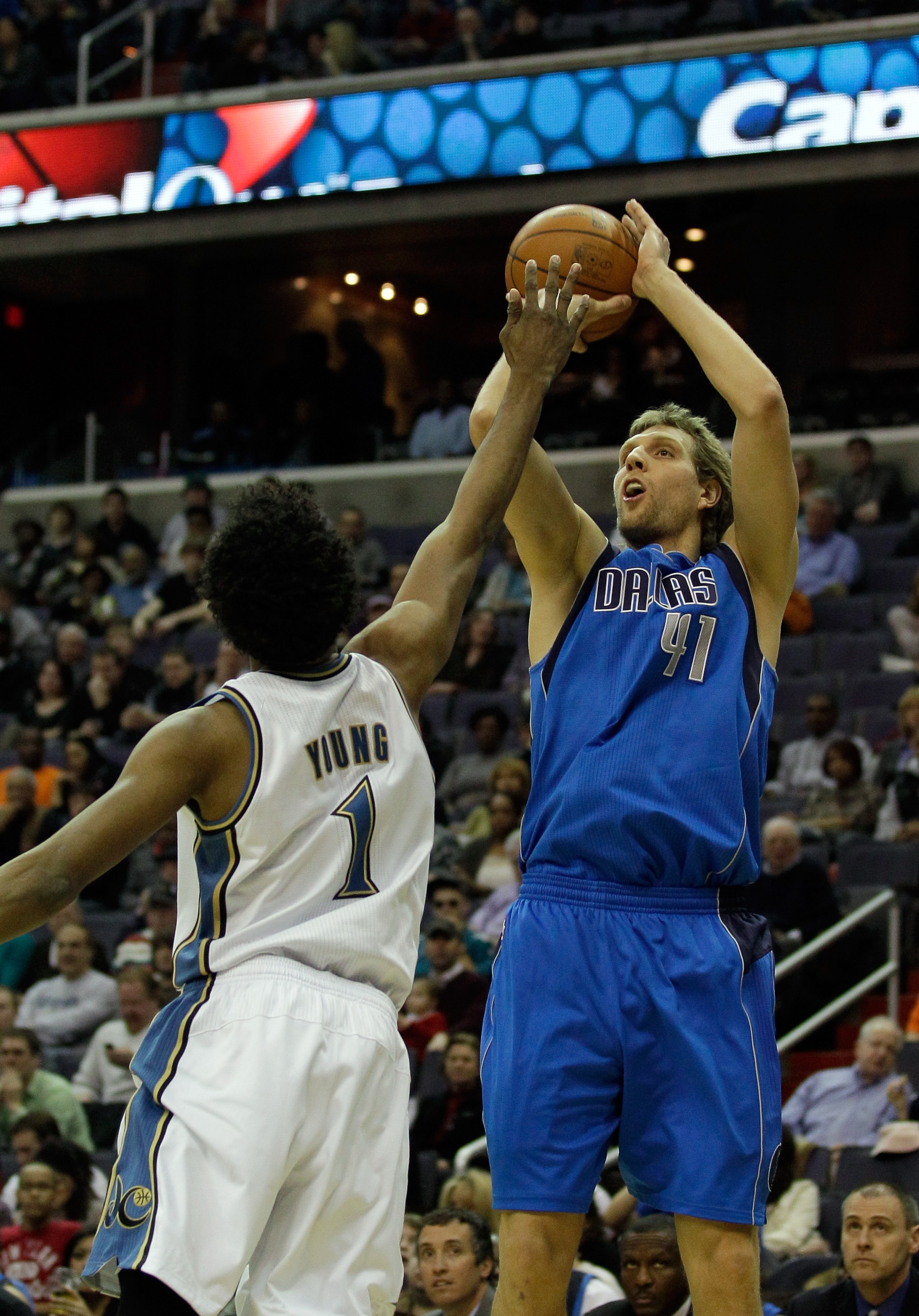 WASHINGTON, DC - FEBRUARY 26: Dirk Nowitzki #41 of the Dallas Mavericks shoots over the defense of Nick Young #1 of the Washington Wizards at the Verizon Center on February 26, 2011 in Washington, DC. NOTE TO USER: User expressly acknowledges and agrees t