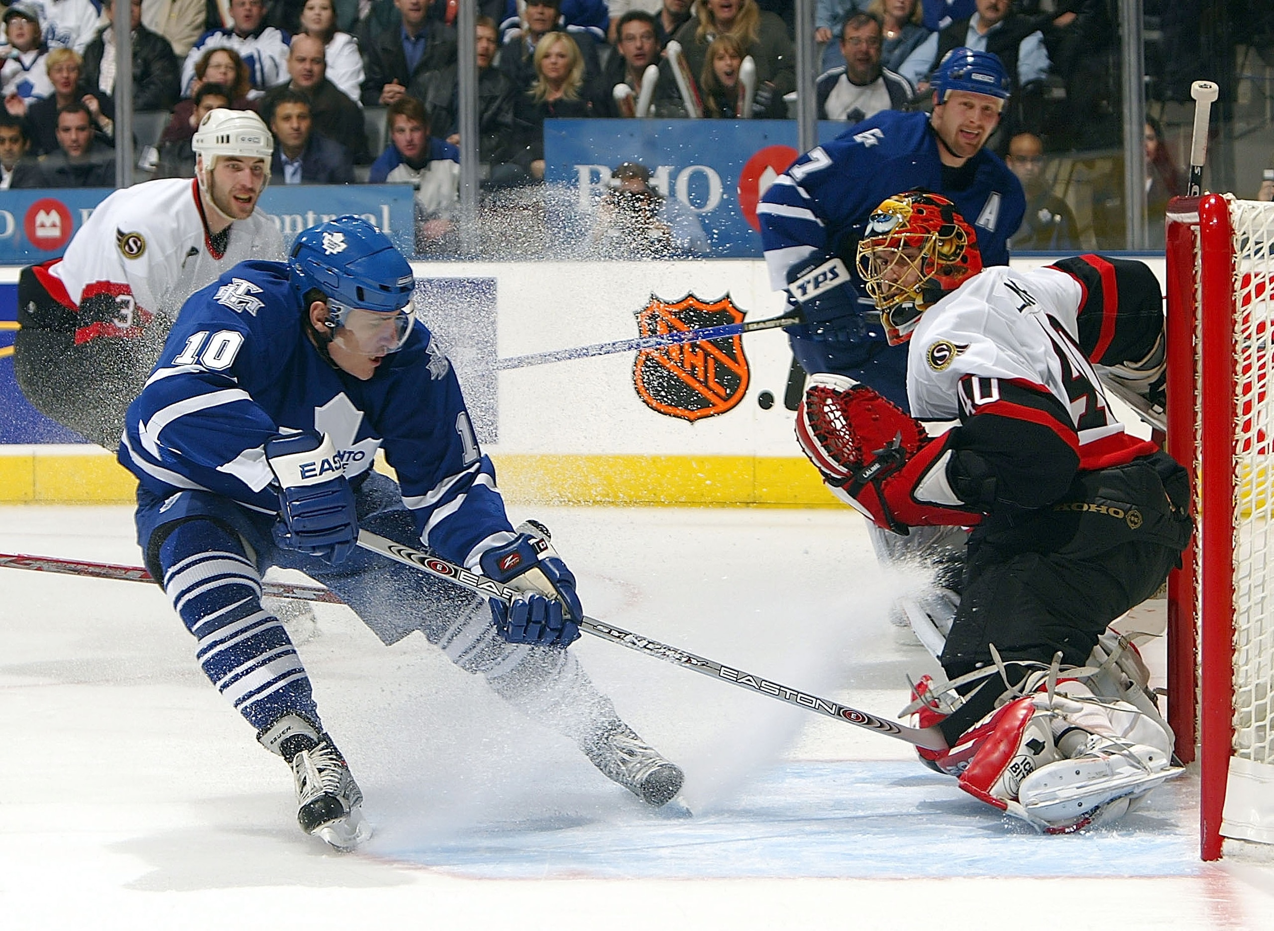 TORONTO - APRIL 16:  Patrick Lalime #40 of the Ottawa Senators slides across the crease as Ron Francis #10 of the Toronto Maple Leafs misses on this scoring opportunity during game five of the Eastern Conference Quarter-Finals at the Air Canada Centre on